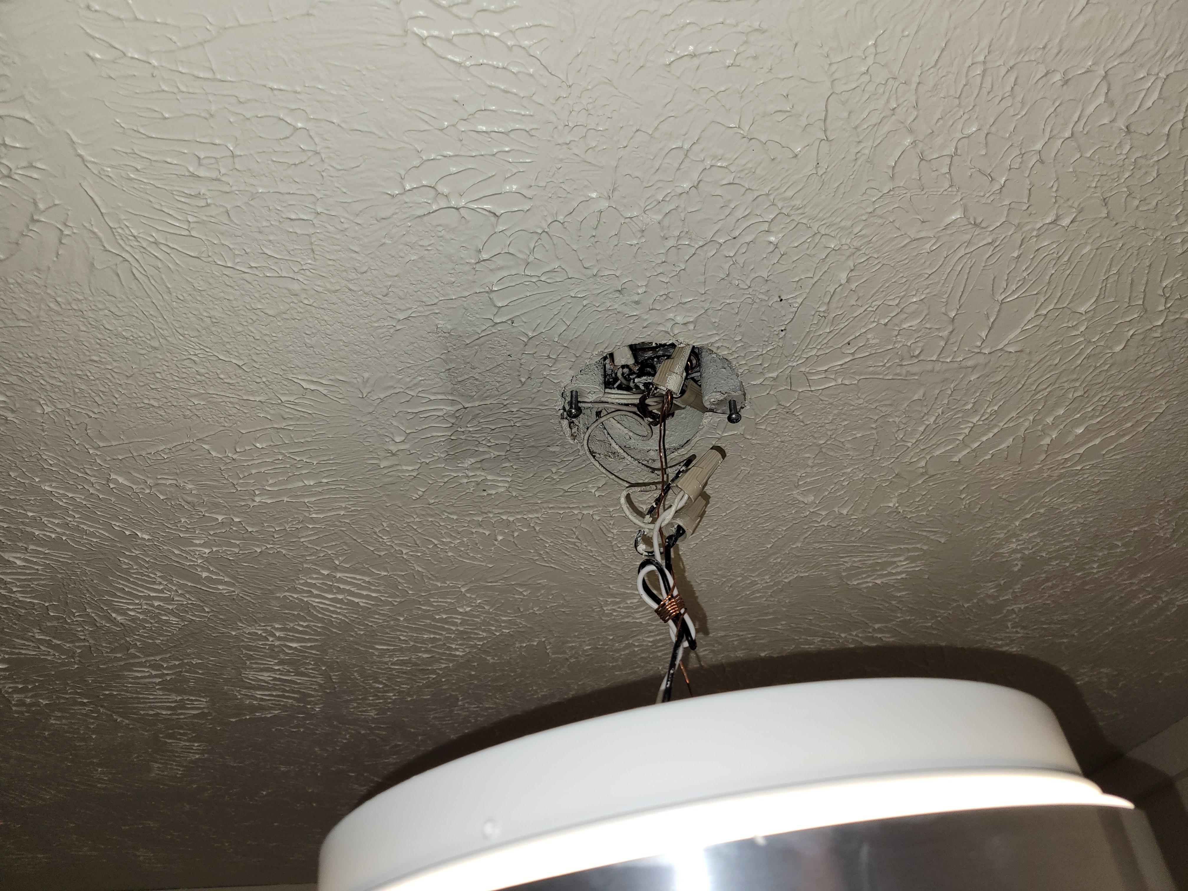 A neighbor knocked the ceiling light off the ceiling. It has been