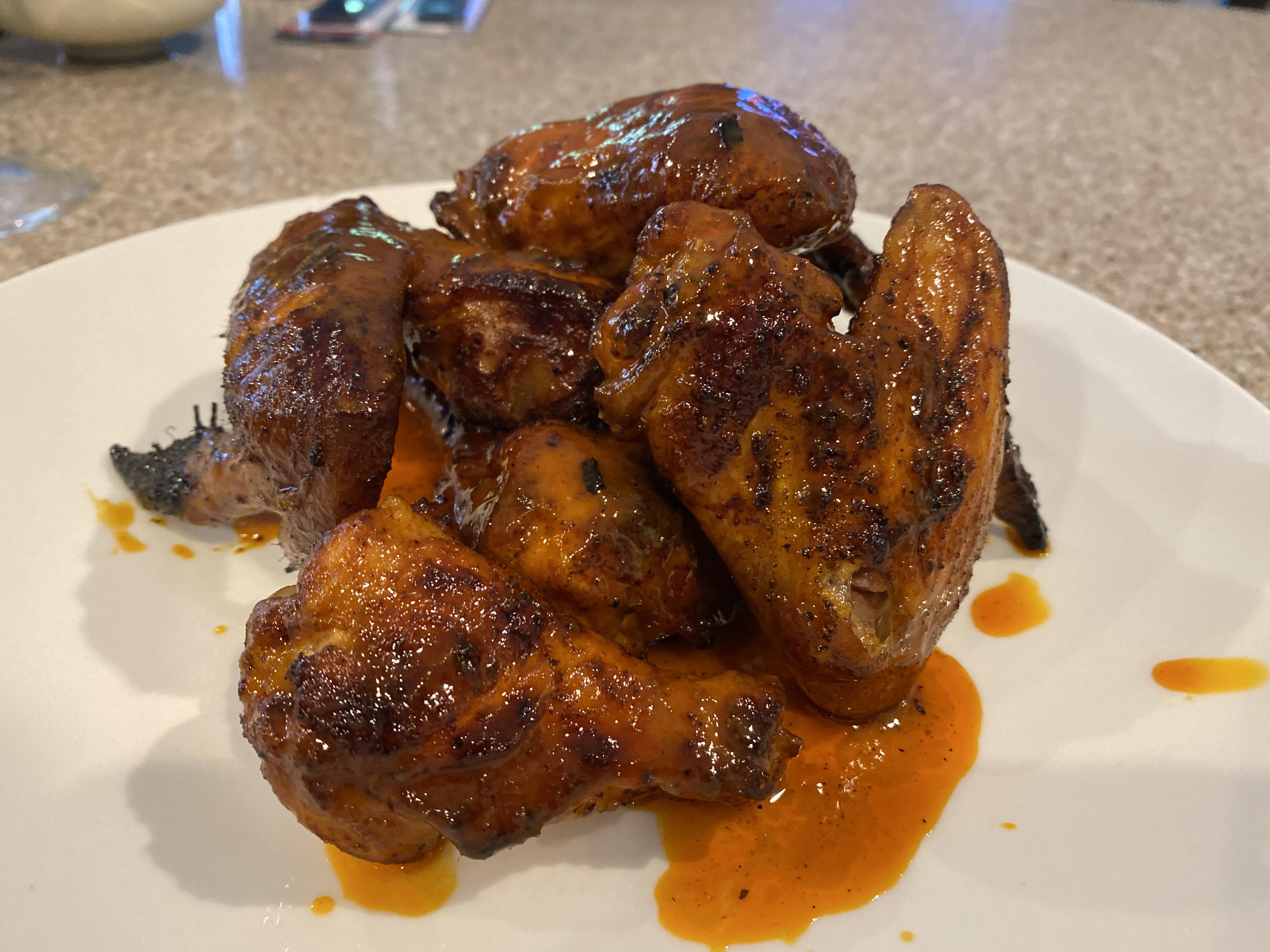 Smoked & Sauced Buffalo Wings on the er to close out the weekend