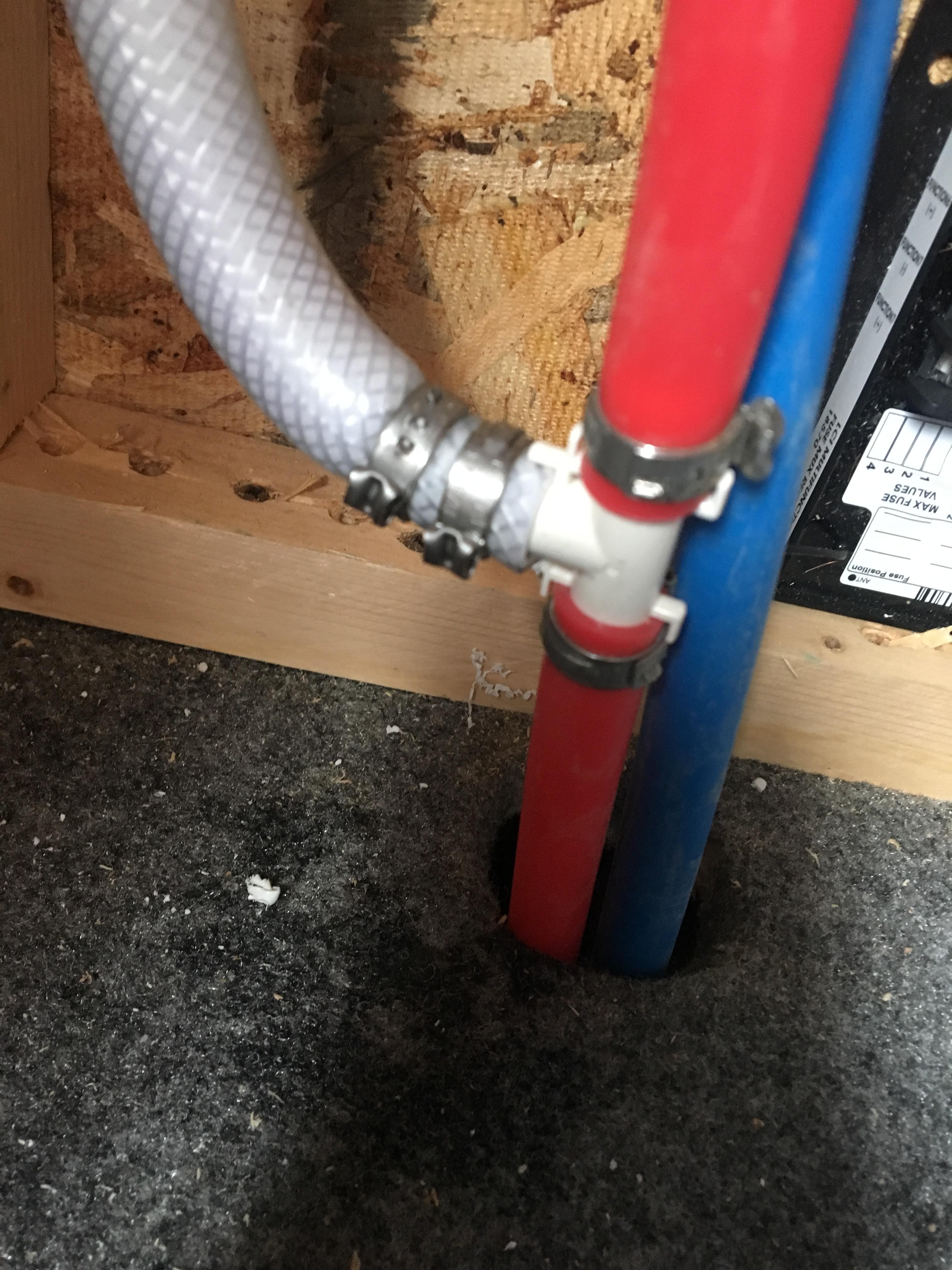 There is a leak here where the white hose connects to the T. The clamp