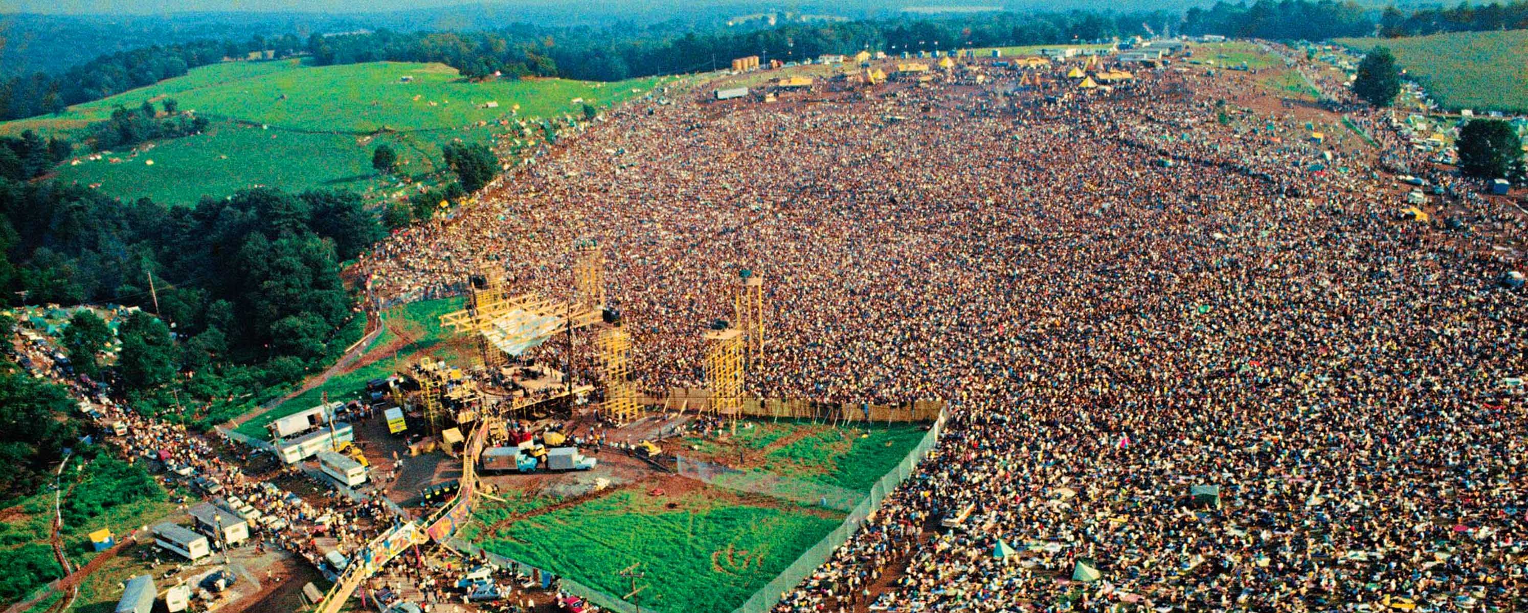 Overhead shot of the crowd at Woodstock (1969). Early estimates were