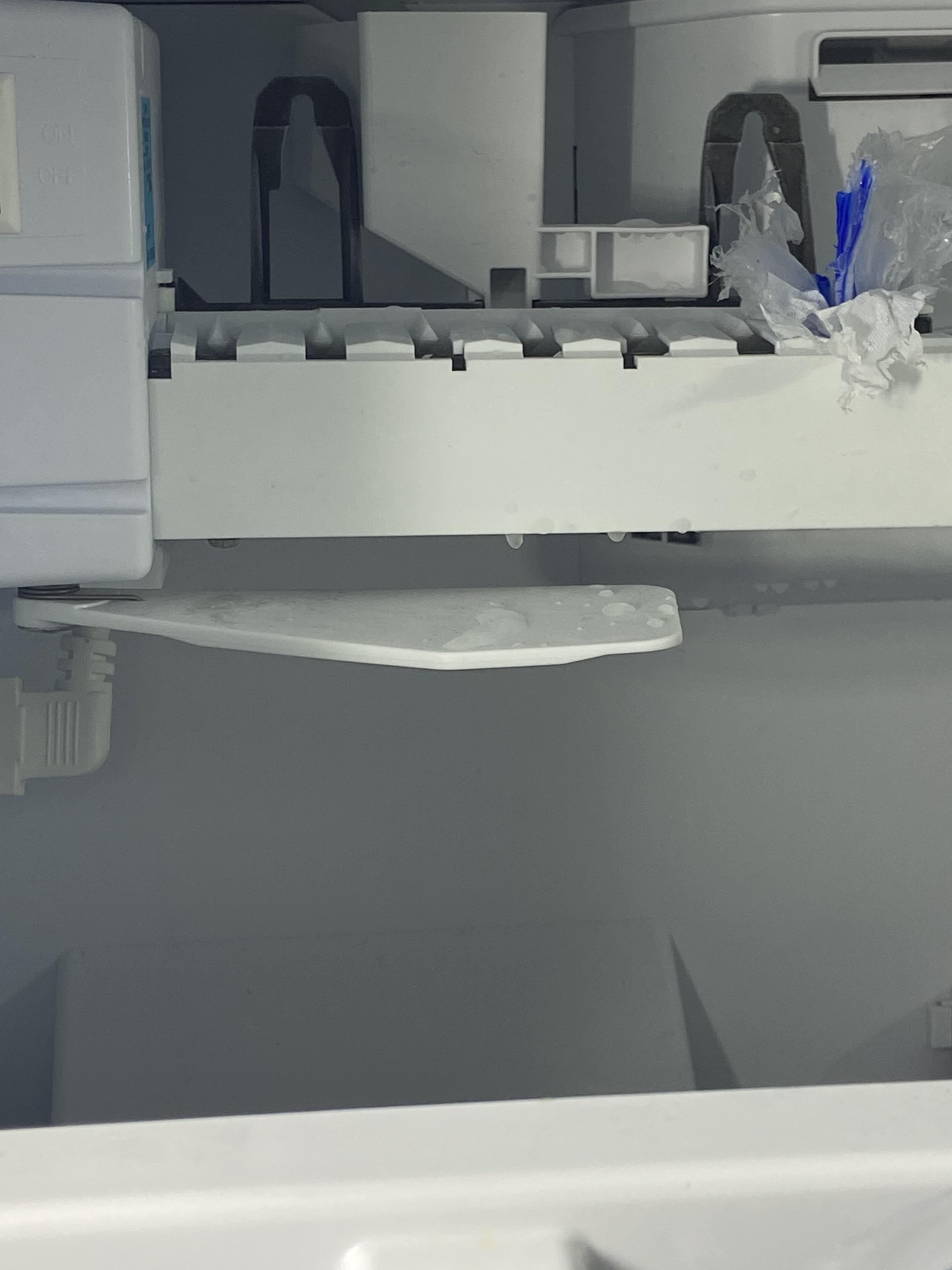 Plastic stuck in ice maker (please don’t judge). How the heck do I get