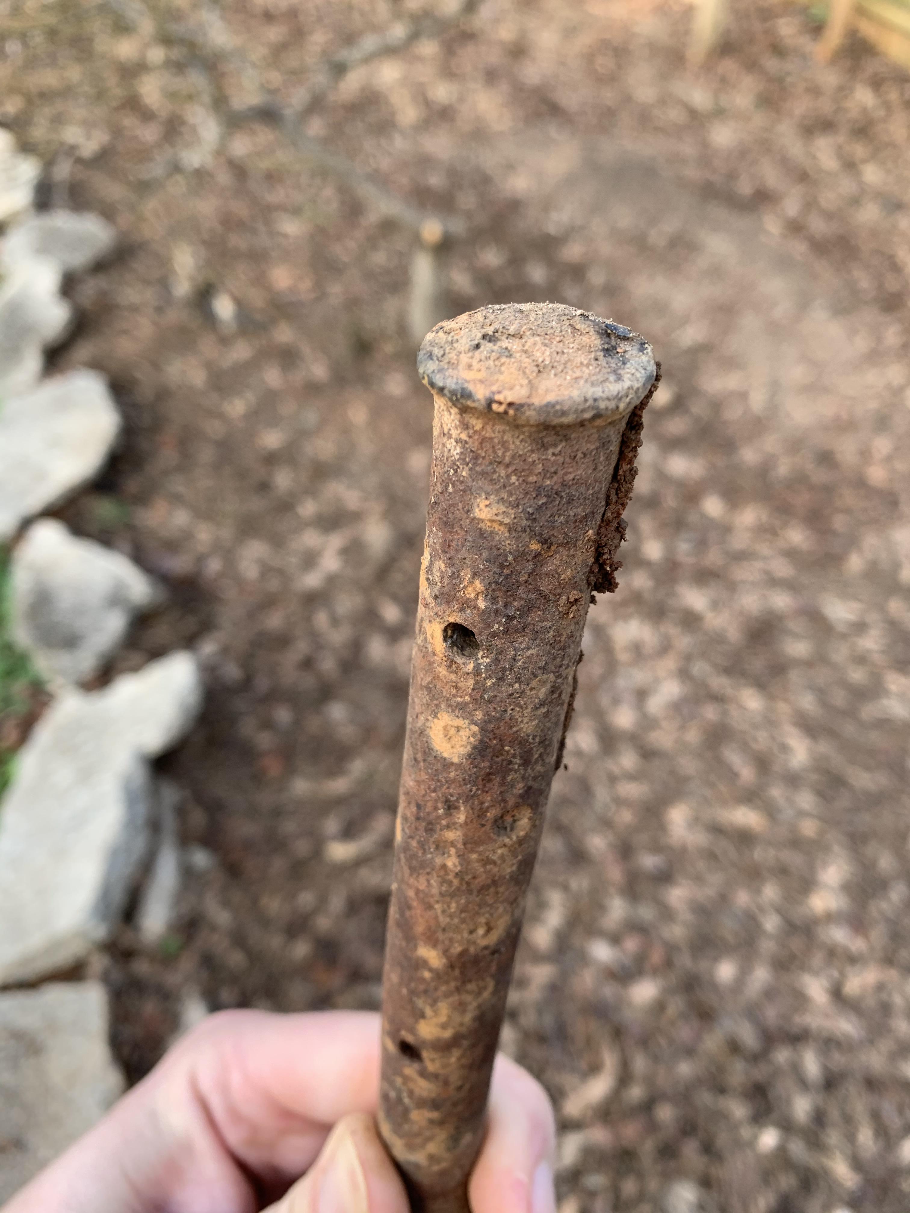 30 inch metal spike found in my yard. Has holes through it the entire