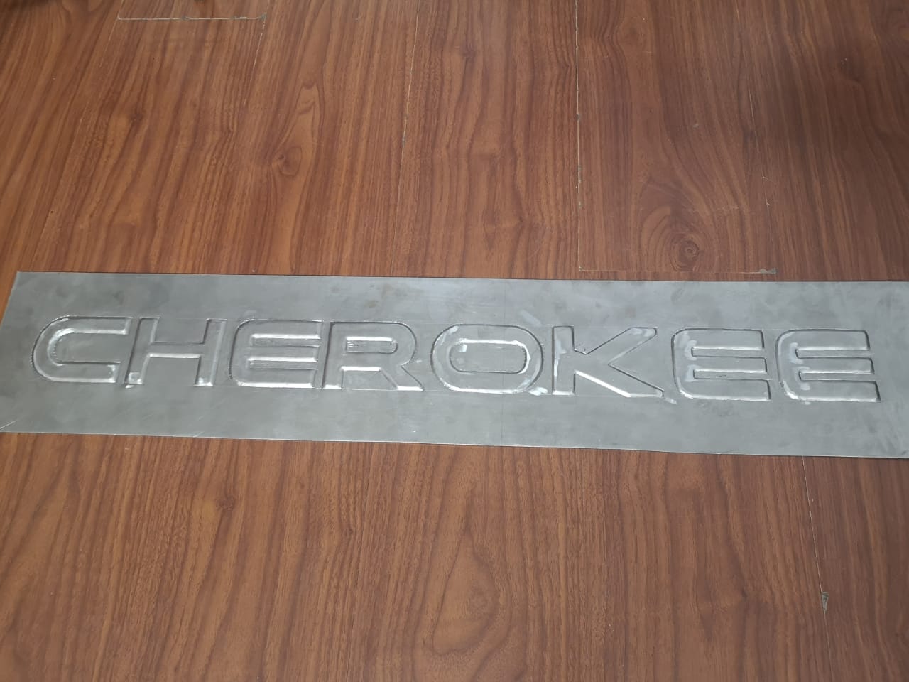 Custom handmade metal embossed plate made by a Pakistani artist r