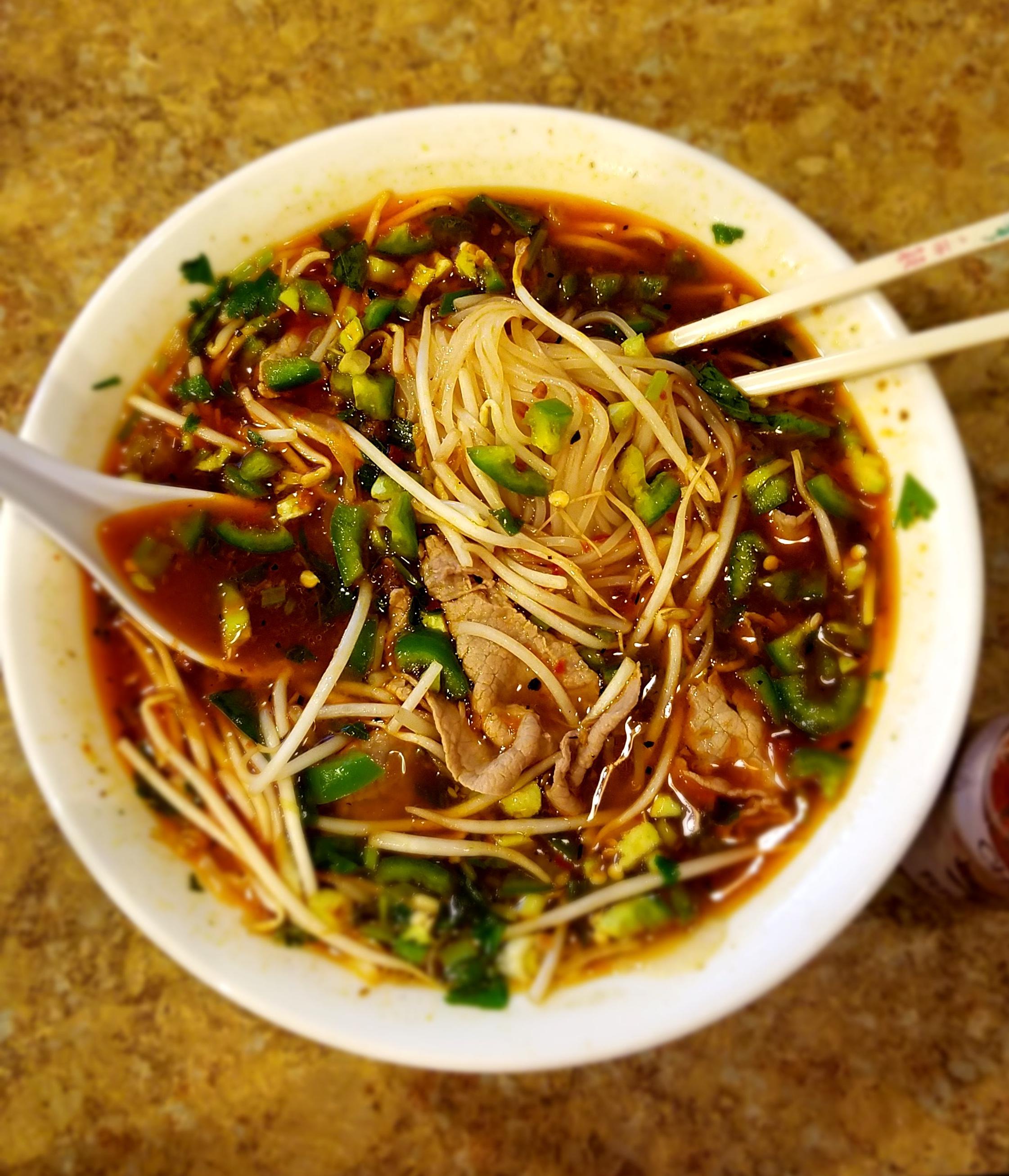 PHO with a copious amount of chopped jalapenos, basil, sprouts, and