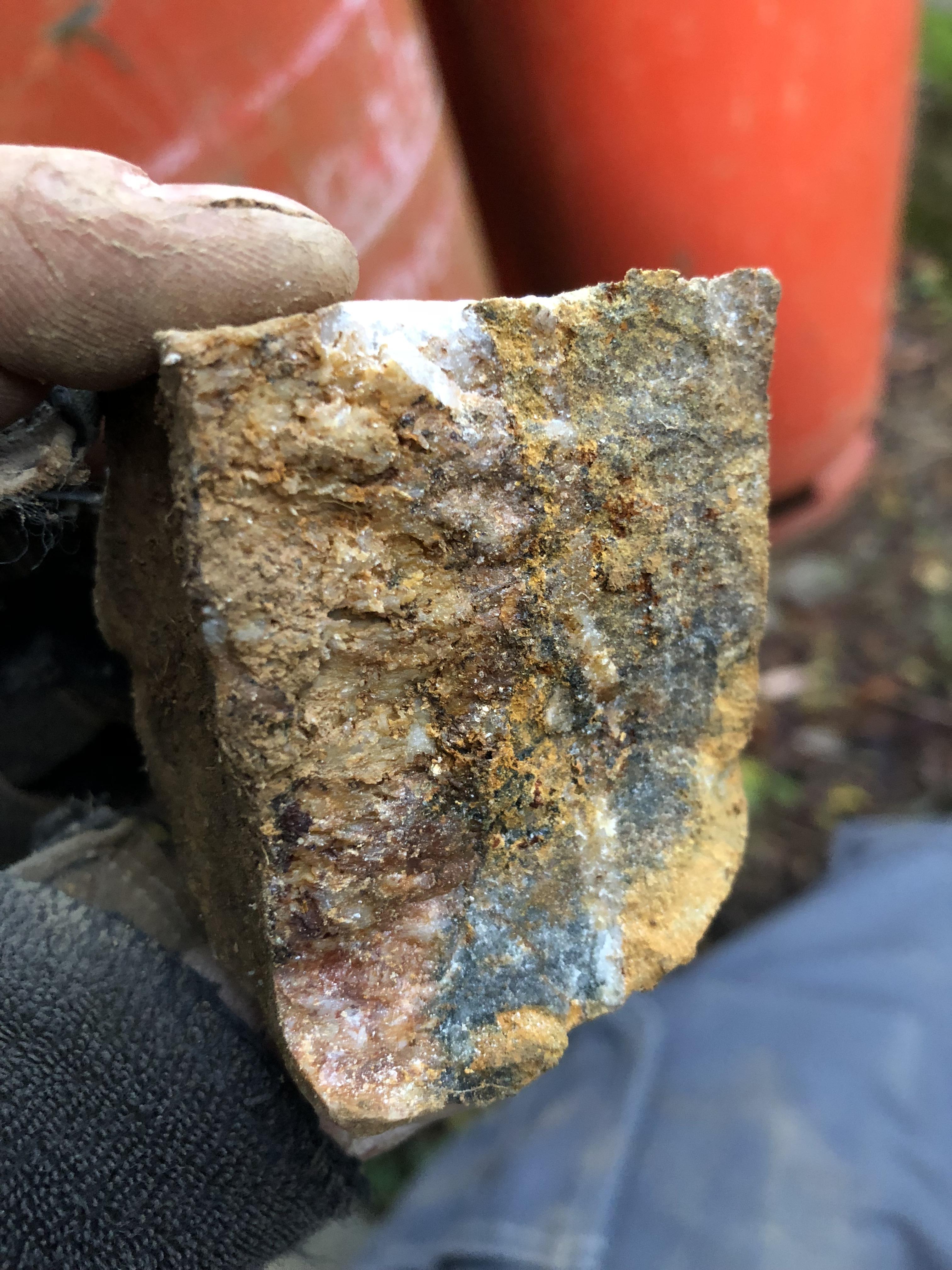 Unsure on the gold specks. At work on Dartmoor with lots of quarts