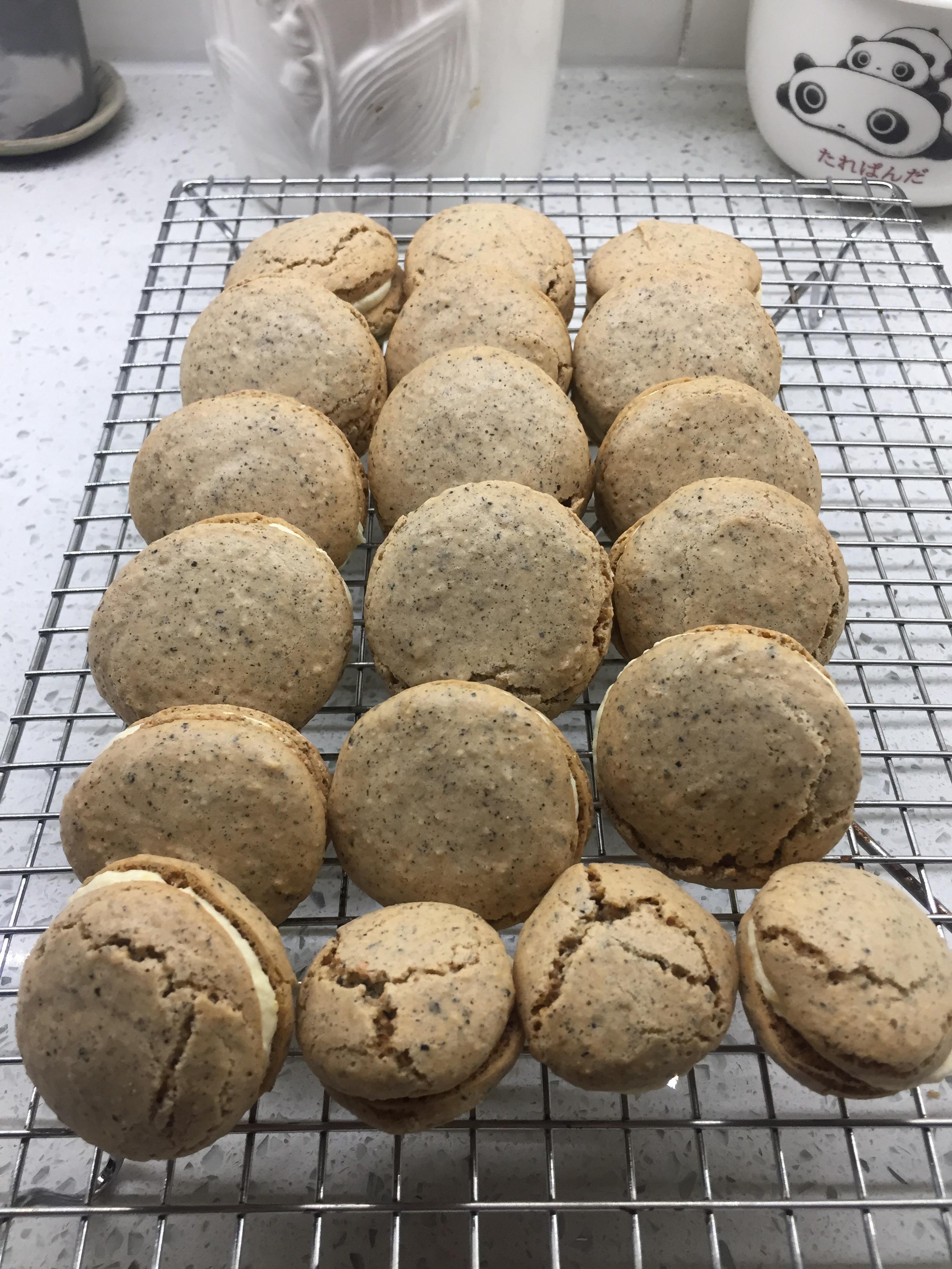 Black sesame macarons with salted duck egg yolk buttercream. I guess it