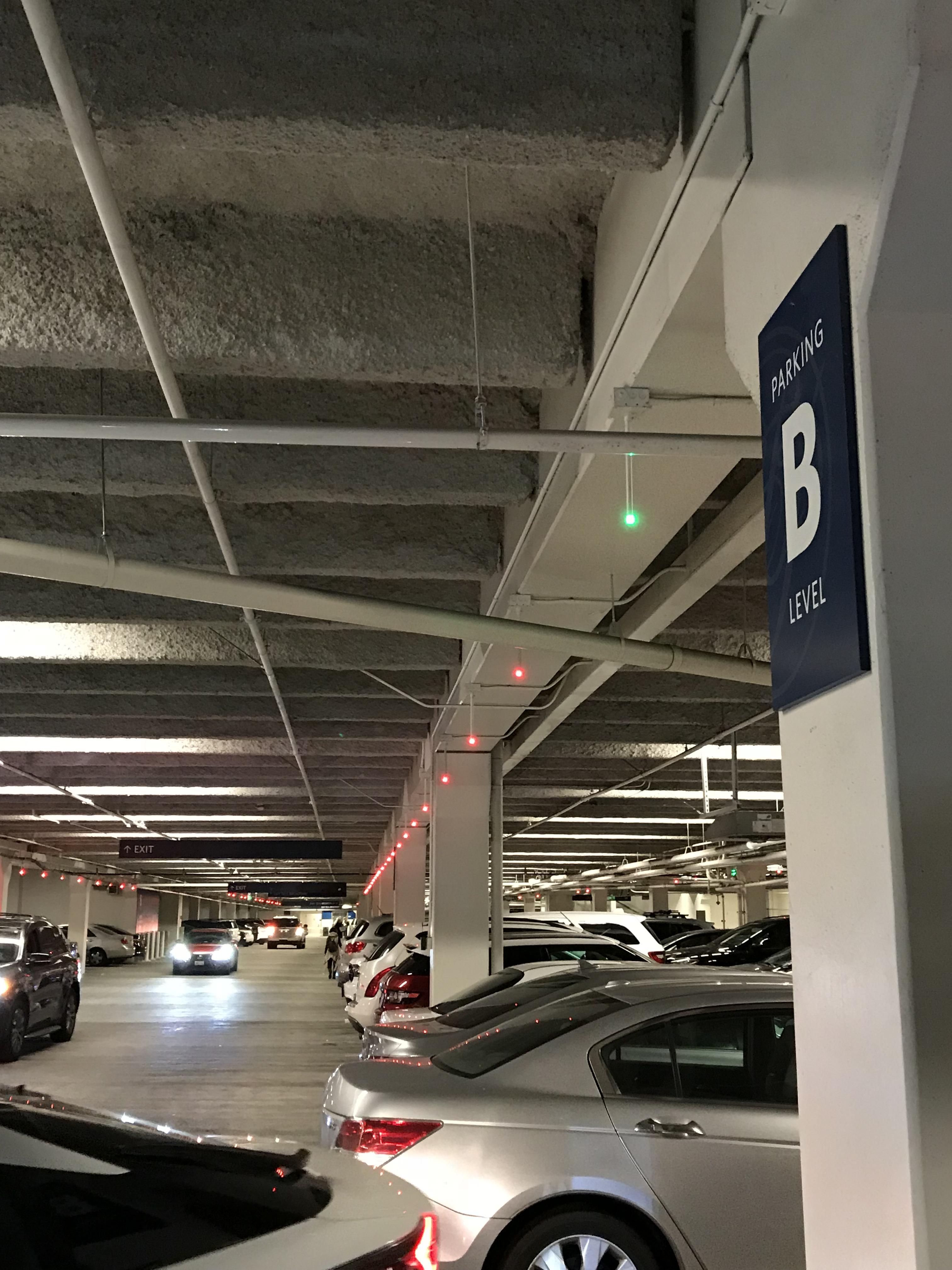 This parking garage has lights to tell you which spaces are open