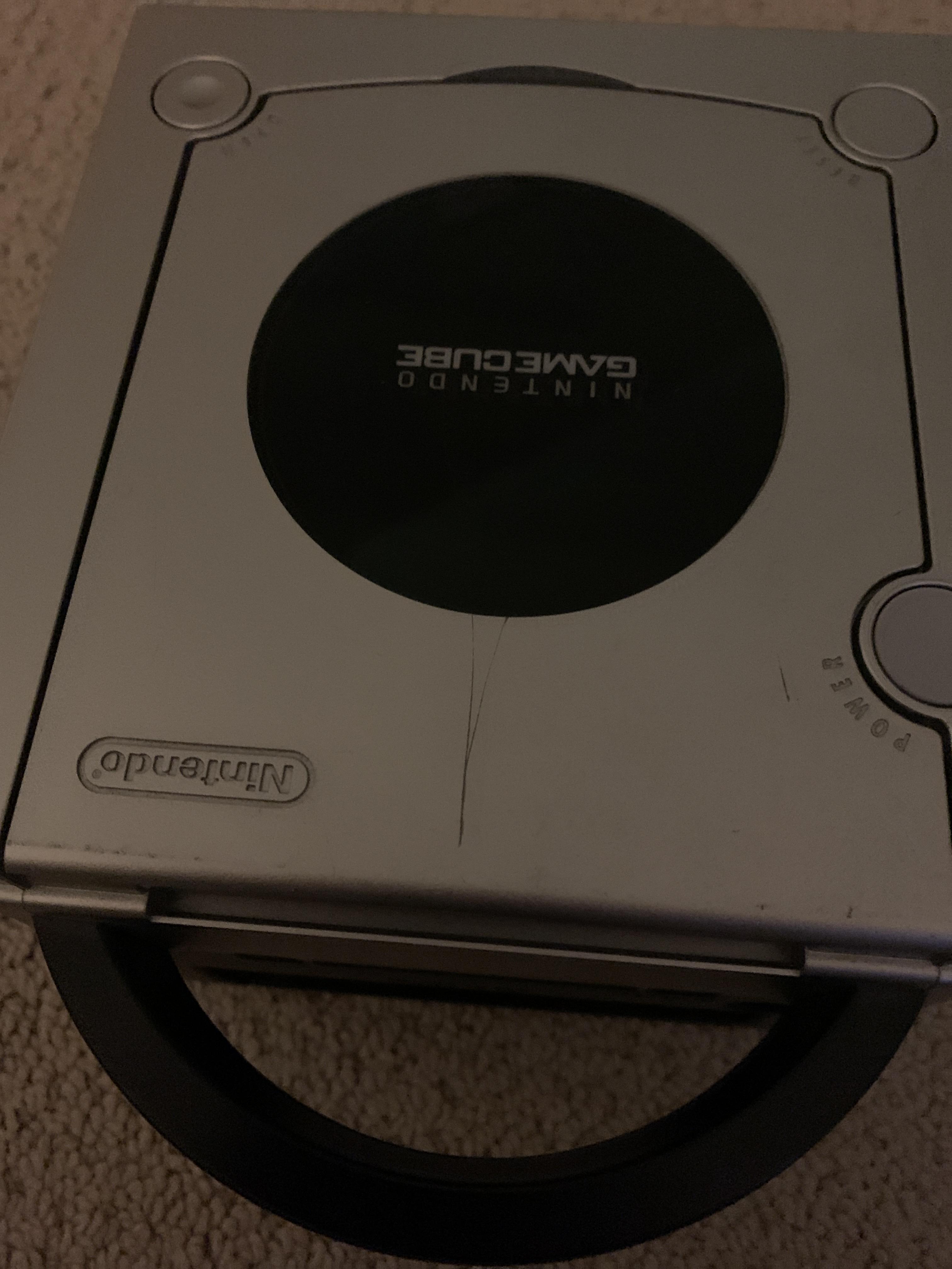 Does anyone know how to fix scratches or make this GameCube in better condition. r/Gamecube