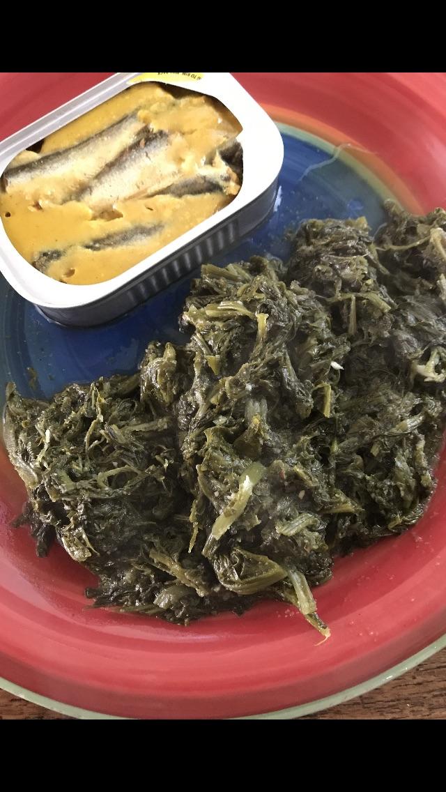 Sardines in a gelatin forward mustard sauce. Served with canned spinach, sautéed with garlic and