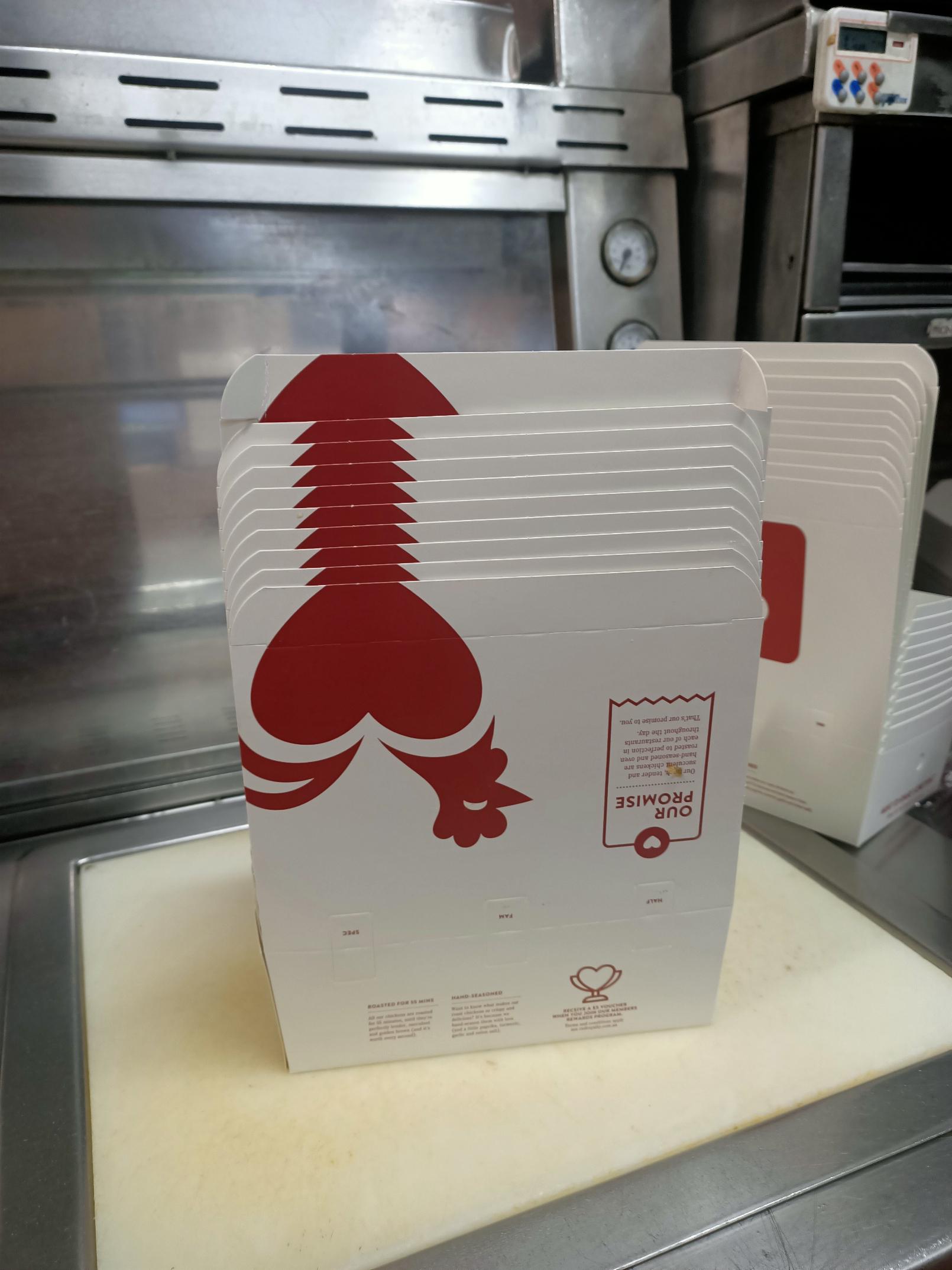 Old stacked chicken boxes at Red Rooster, Australia r/theyknew