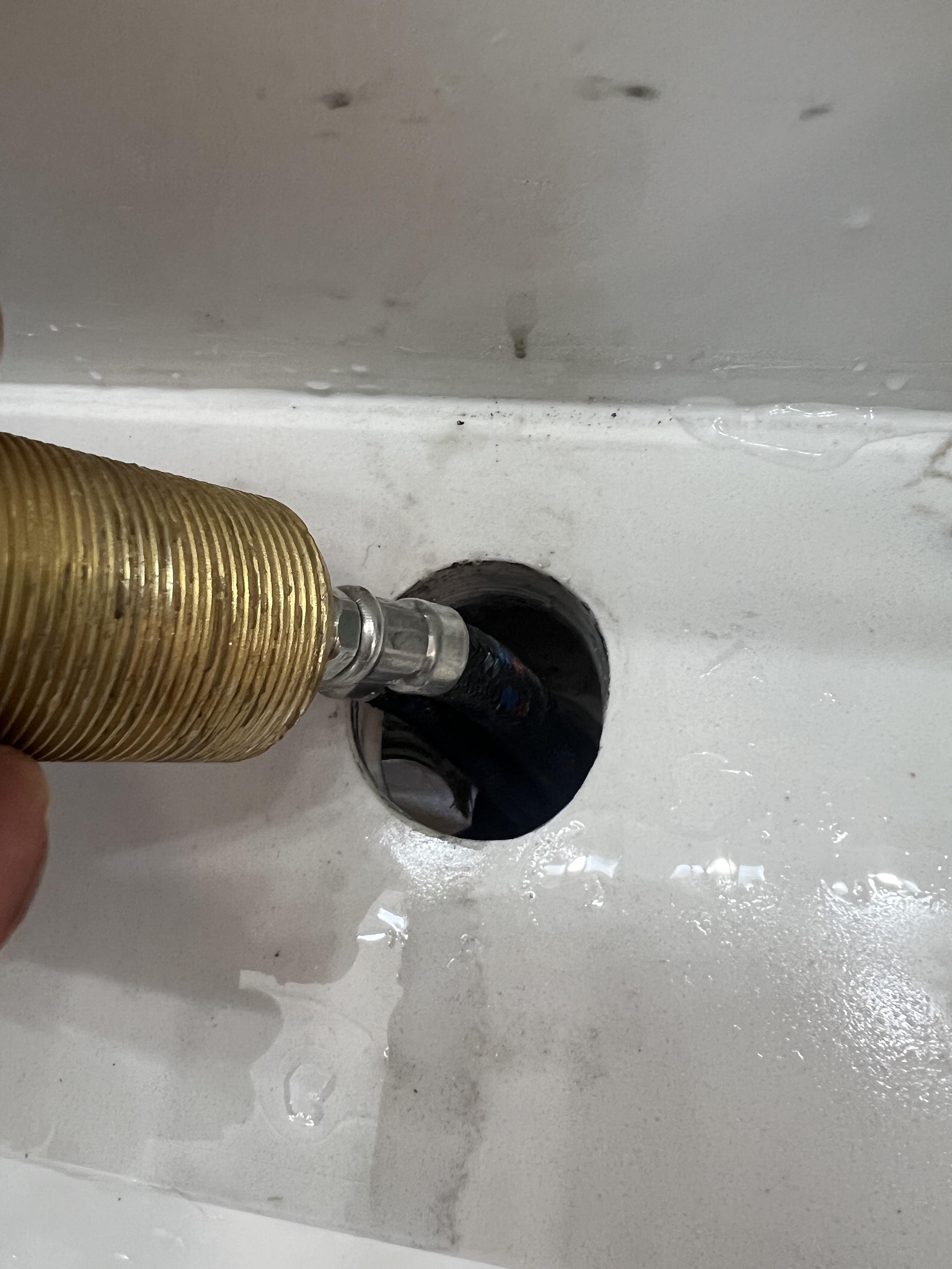 Plumber cut an oval hole in the vanity, leaks now. Ideas for a fix? r