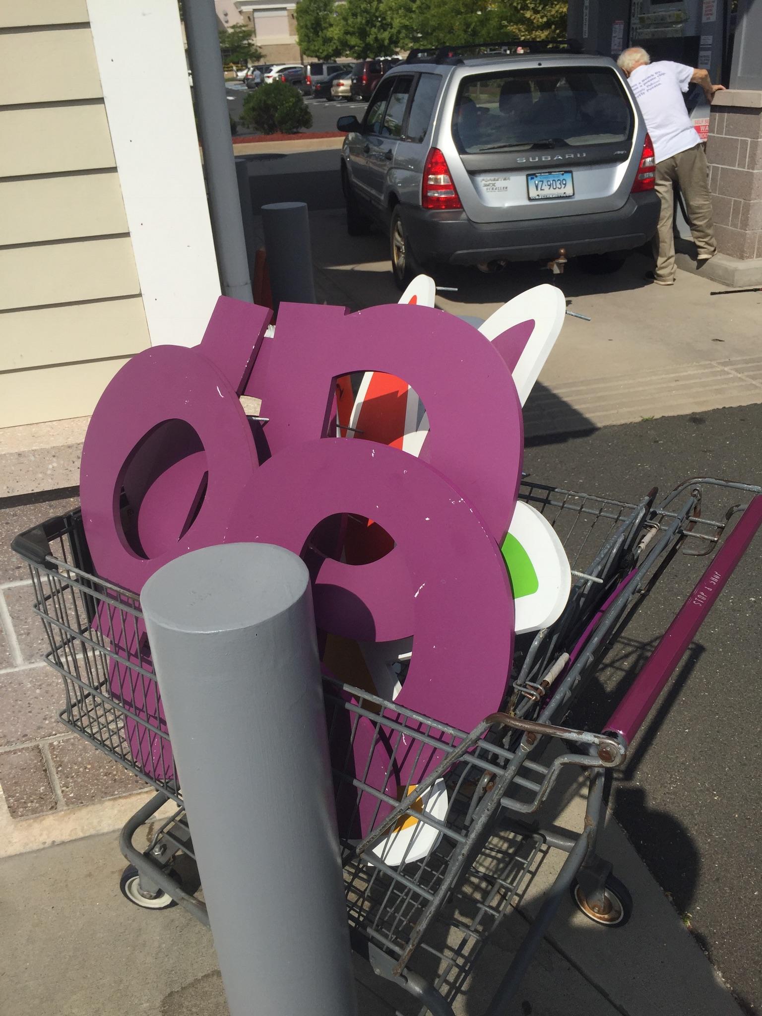 Remains of old Stop & Shop “fruit bowl” logo sign by gas station