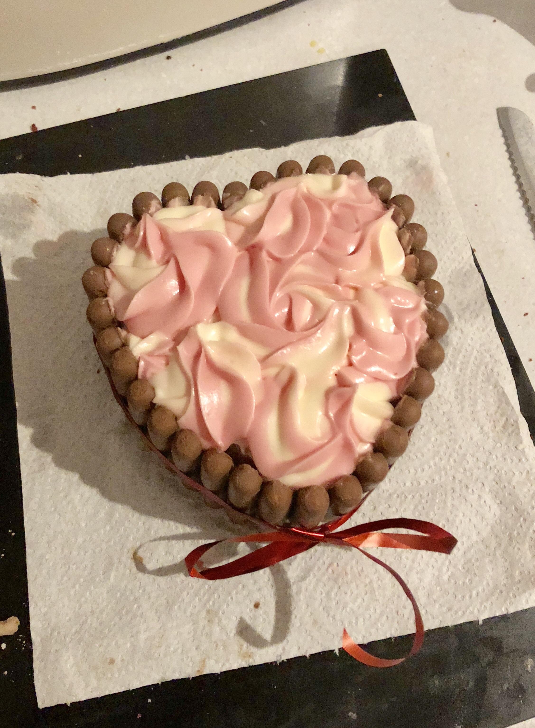 Made a red velvet heart cake with swirly cream cheese frosting for mine