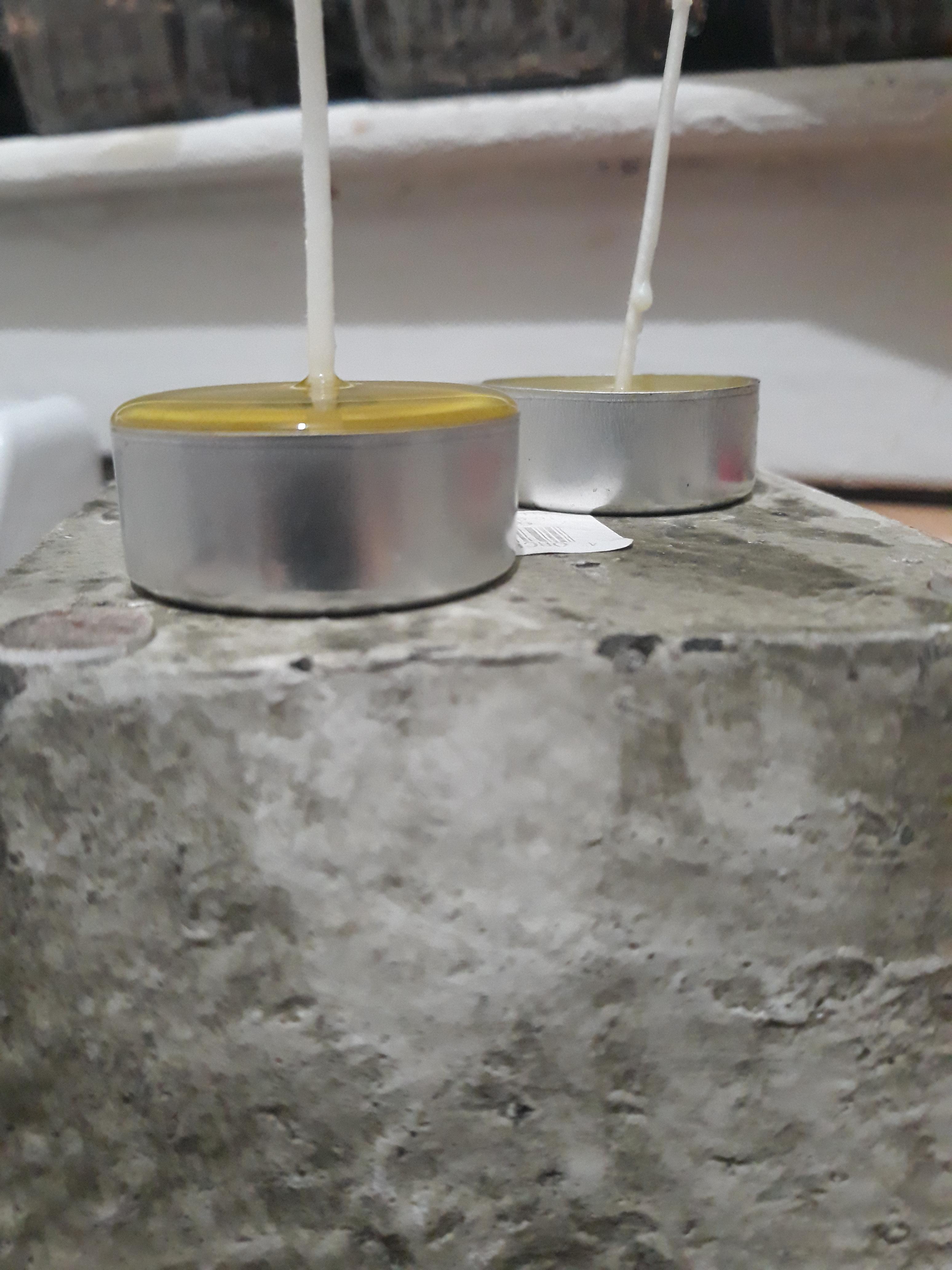 Poured wax into a tealight foil to make a candle. Perfect fit, without