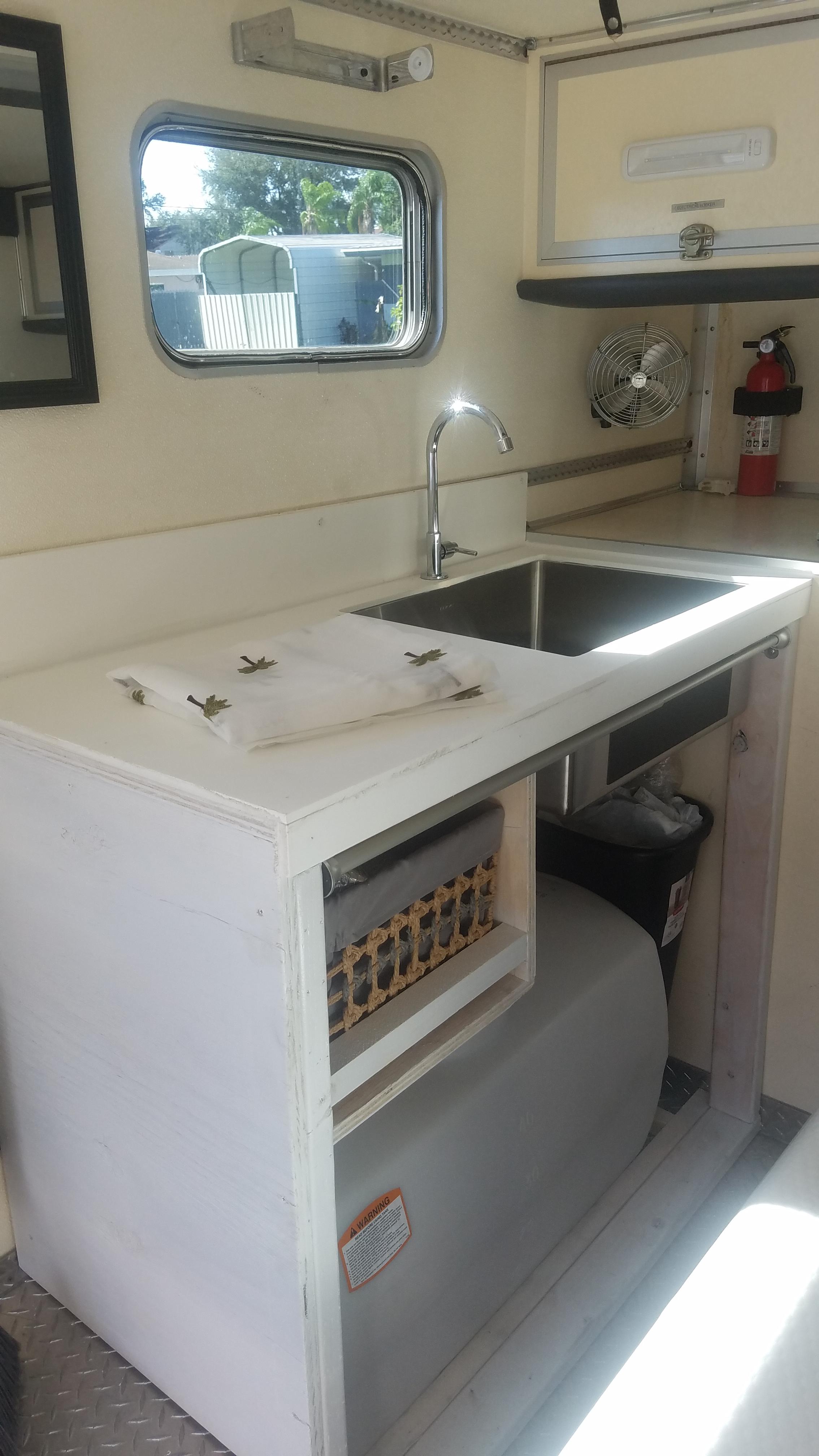 Sink install with 50 gallon water tank. Just waiting on our foot pump