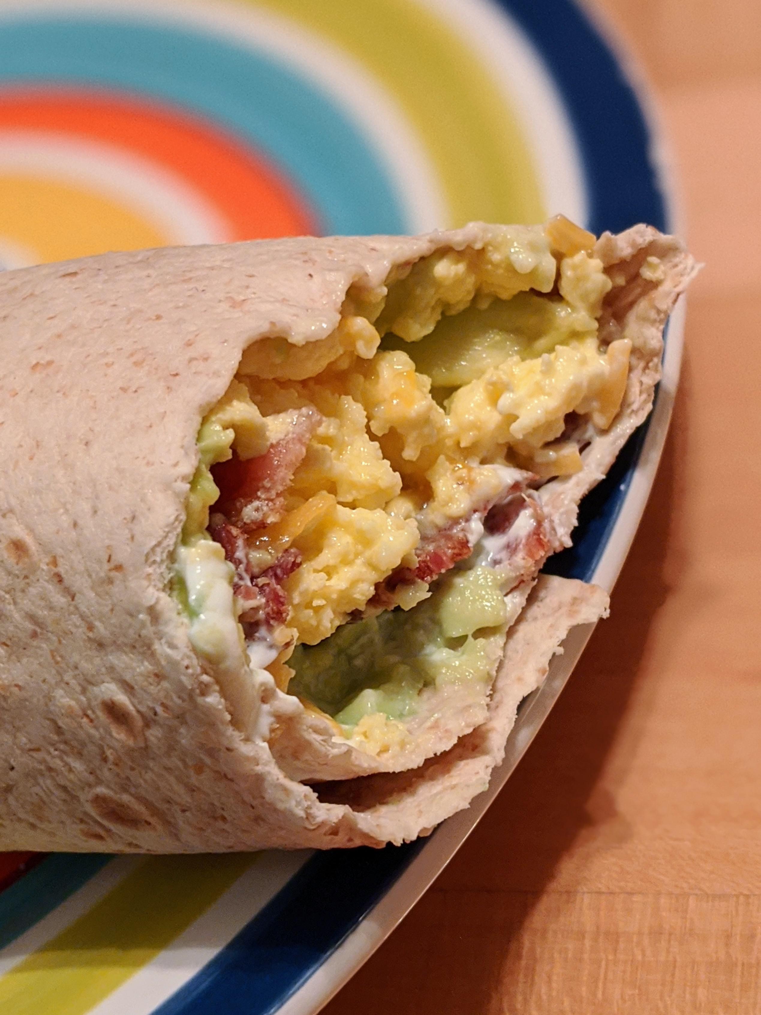 Avocado, Bacon, and Egg Burrito, with cheese and sour cream. ketorecipes
