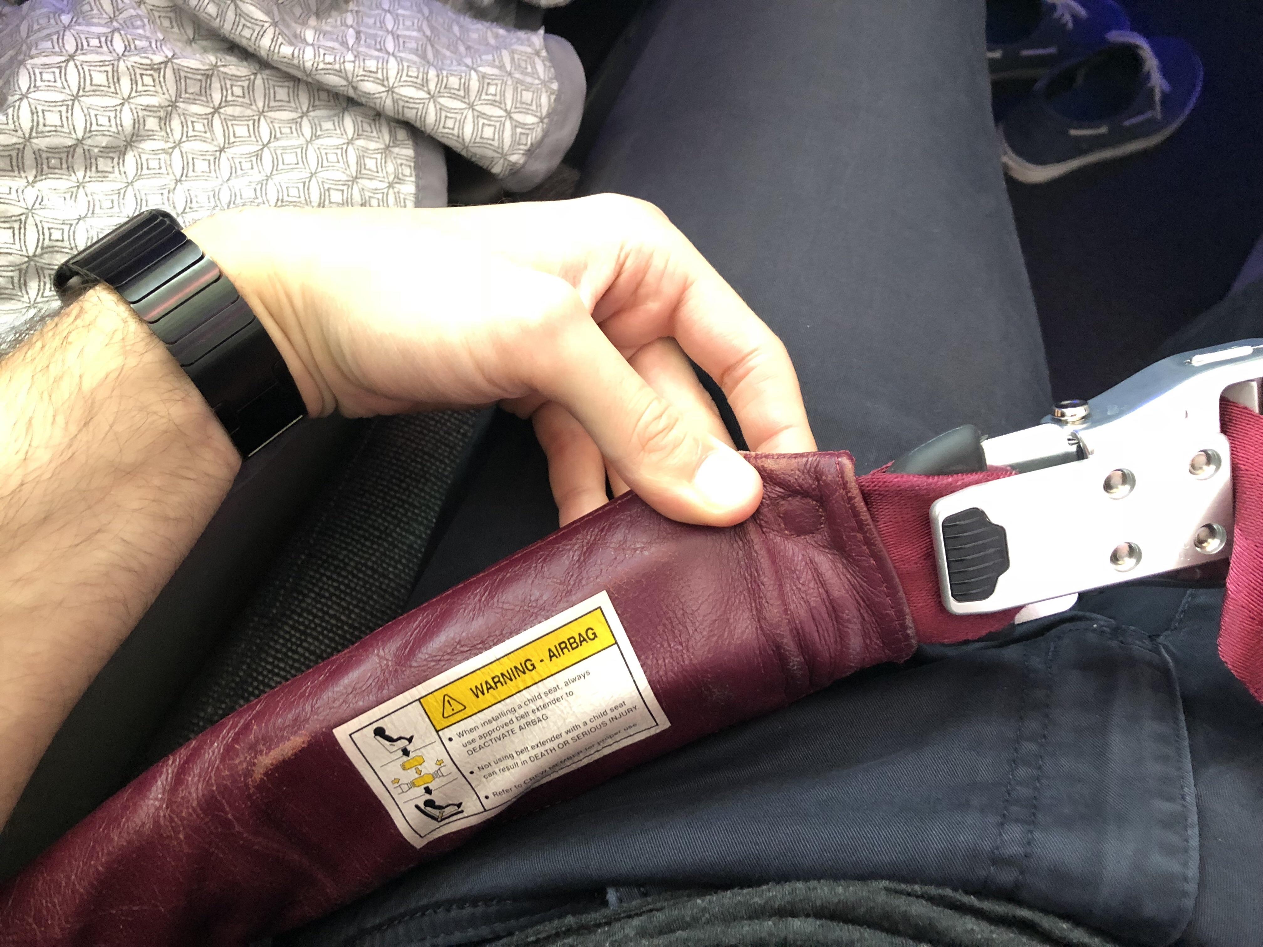 Business Class airplane seats can have airbags in the seatbelts r