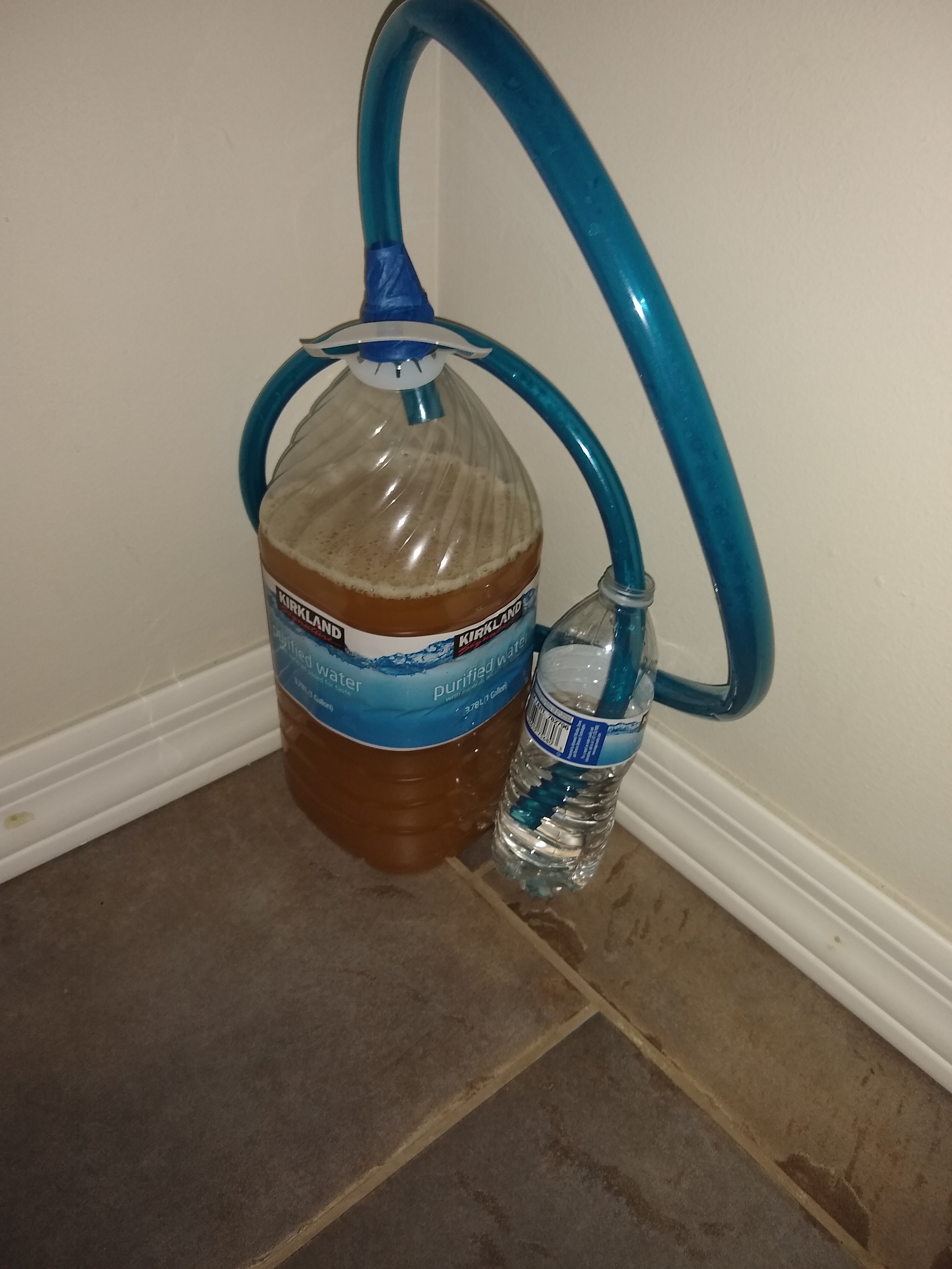 My homemade mead and airlock system that I made for it. r/mead