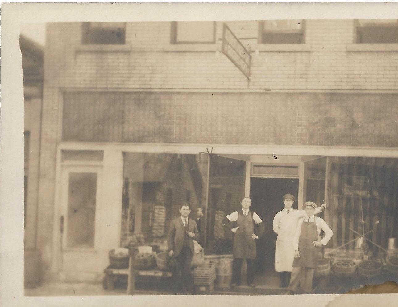 Can anyone help me read the sign in the store front the? r/estoration