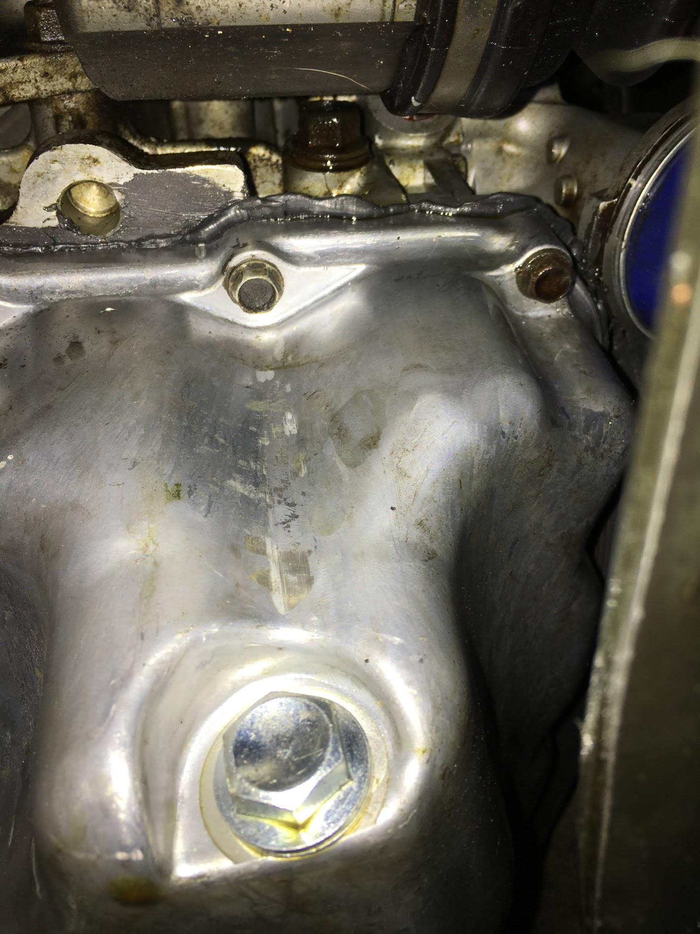 Oil is leaking from a bolt right above the oil pan on my 2005 HONDA