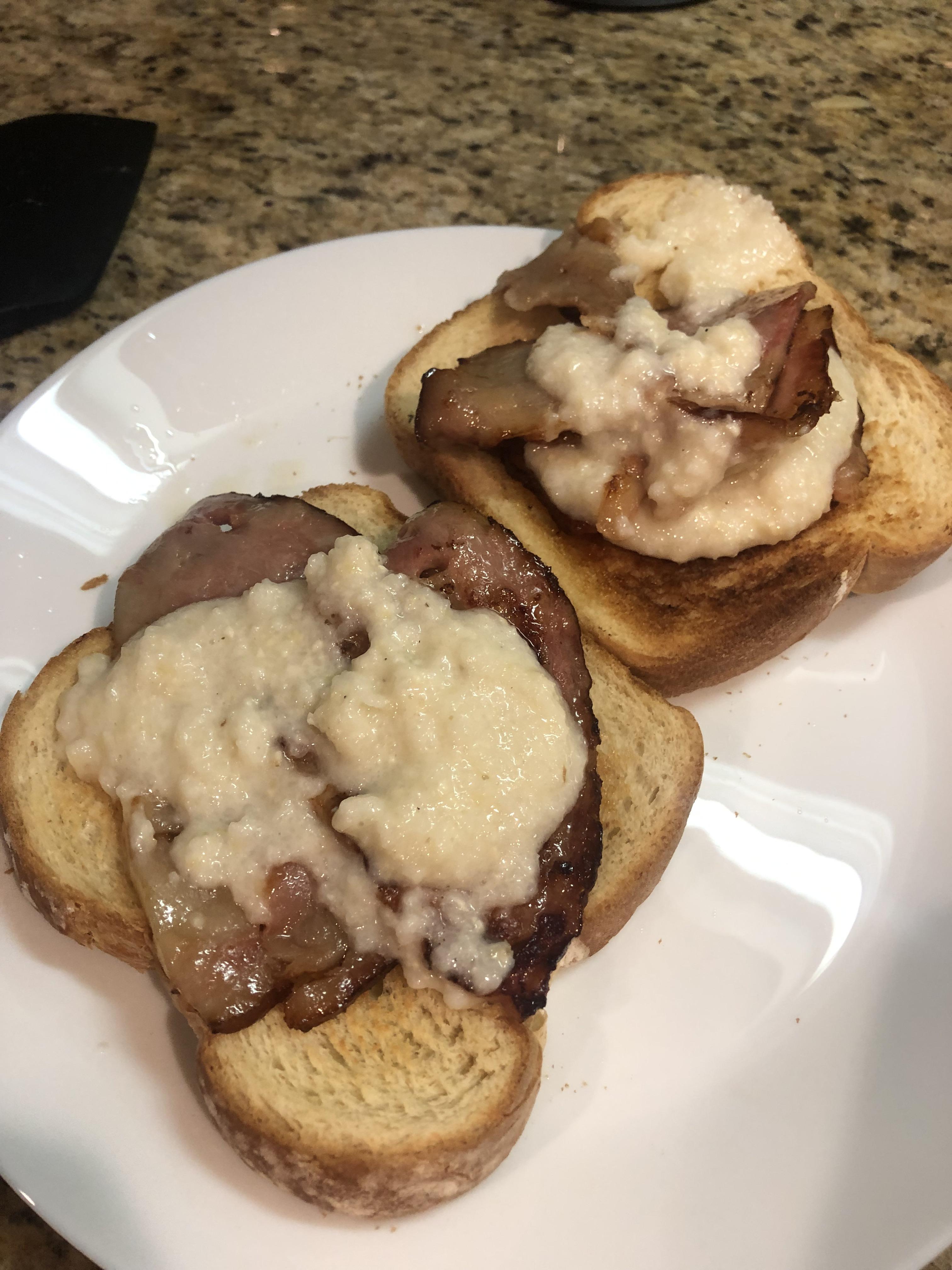 Pig jowl bacon and grits over toast. In case you were wondering, it’s delicious. r/shittyfoodporn