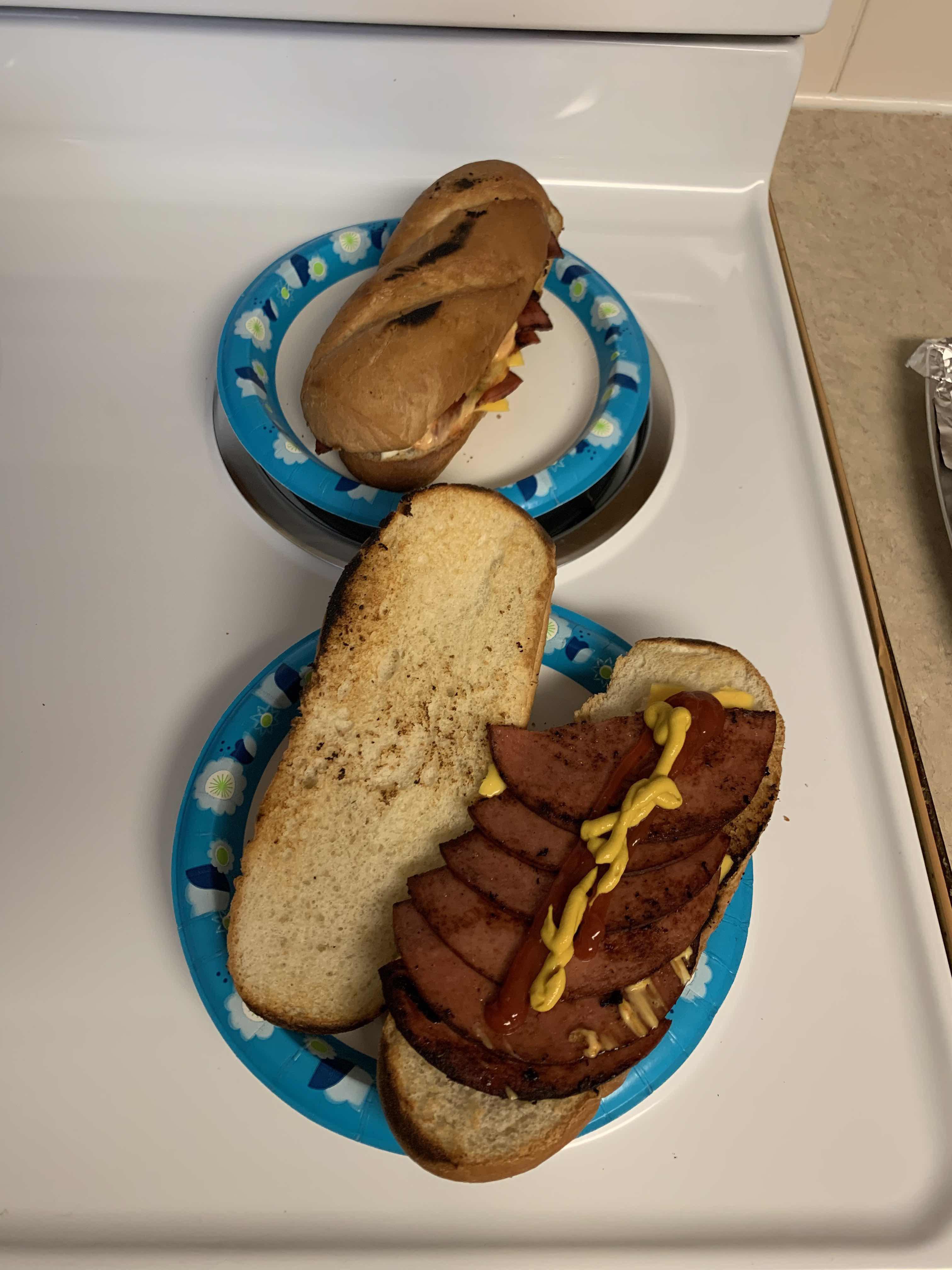 My friend thinks his bologna sandwich looks good. I thought it belonged