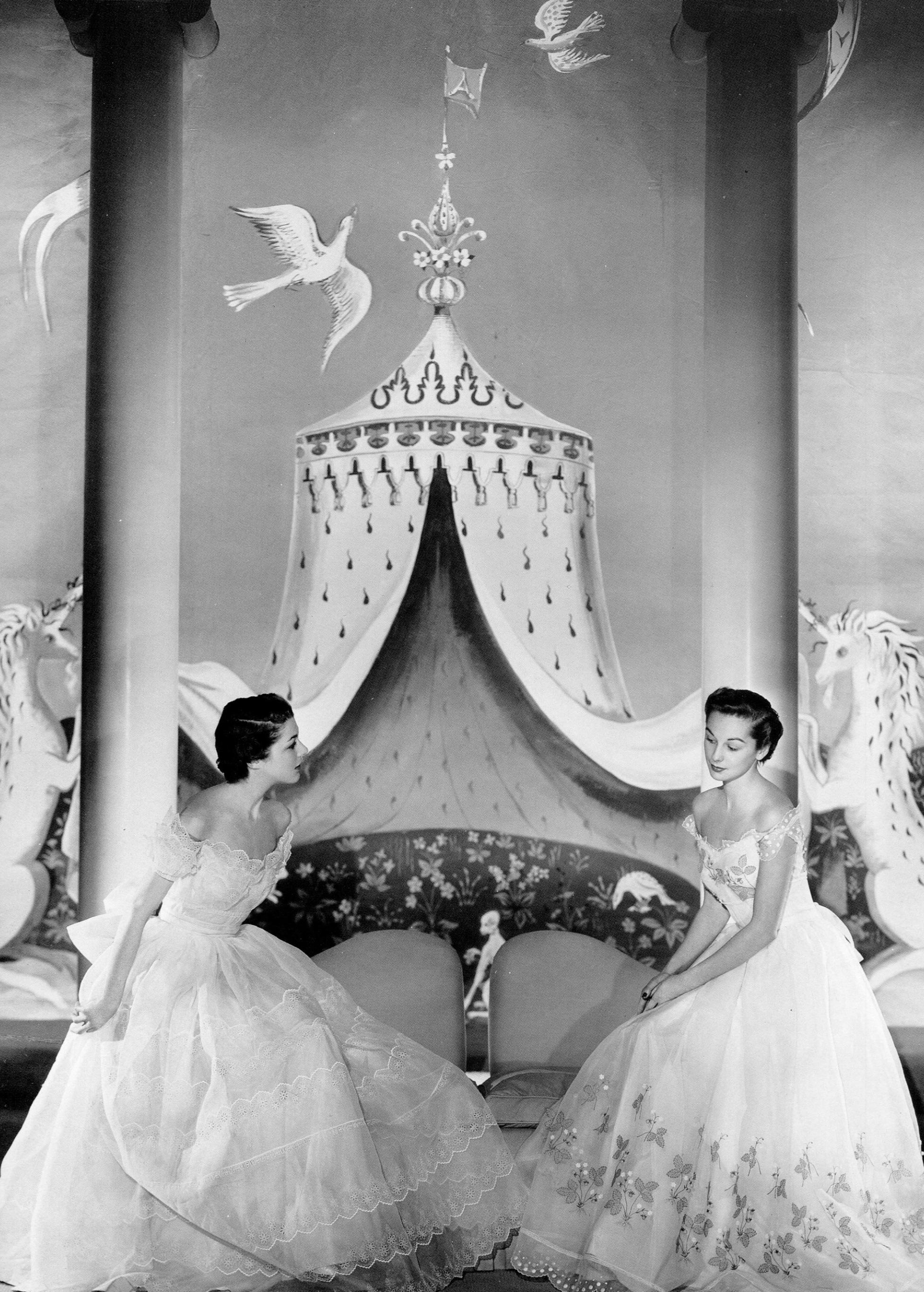 Models wearing gowns by Hollywood costume designer Adrian photographed