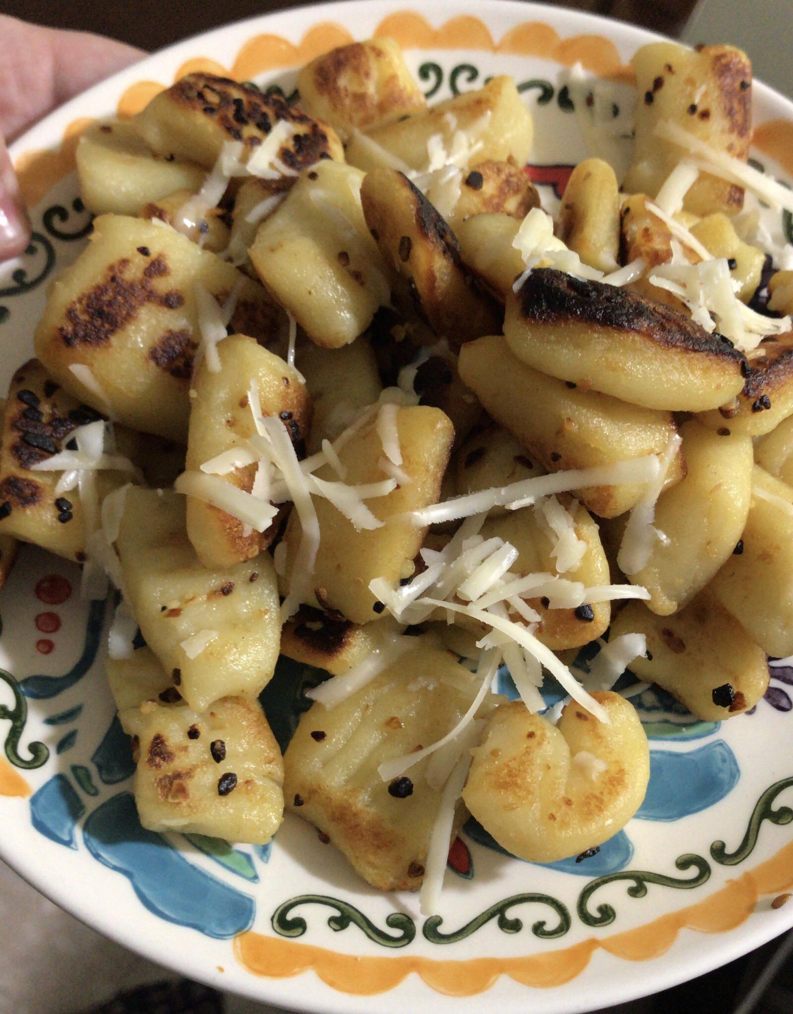 [homemade] pan fried gnocchi with garlic butter and fresh Parmesan r/food
