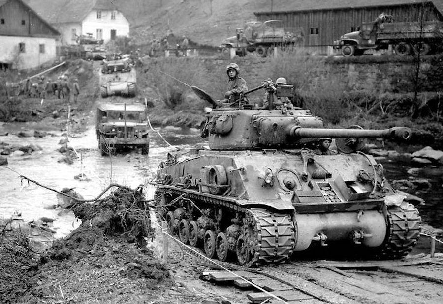 An M4 Sherman tank and men of the 3rd Infantry Division entering