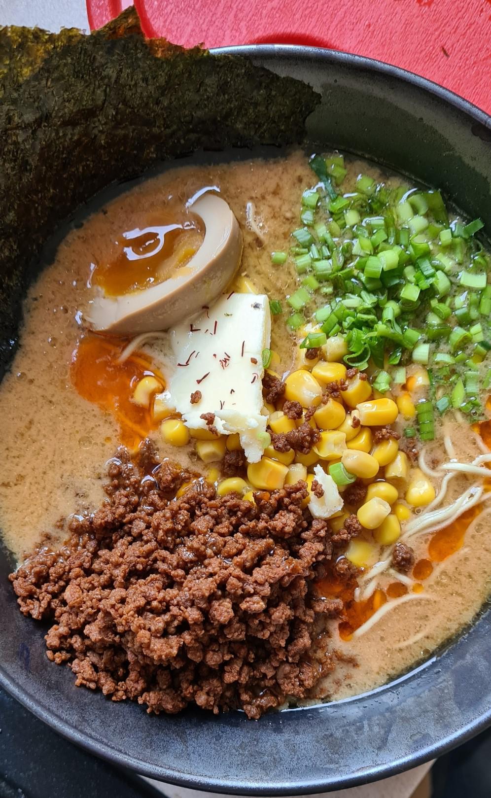 Miso ramen with thin noodles. Spicy beef, home made butter and a touch