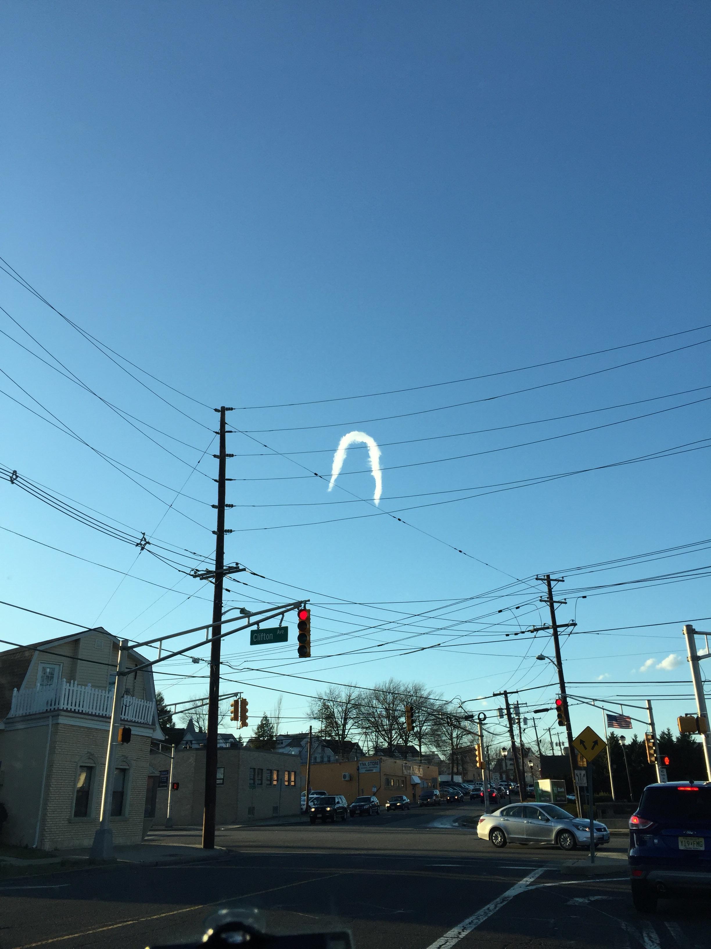 This horseshoe shaped cloud rolled across the sky over my town