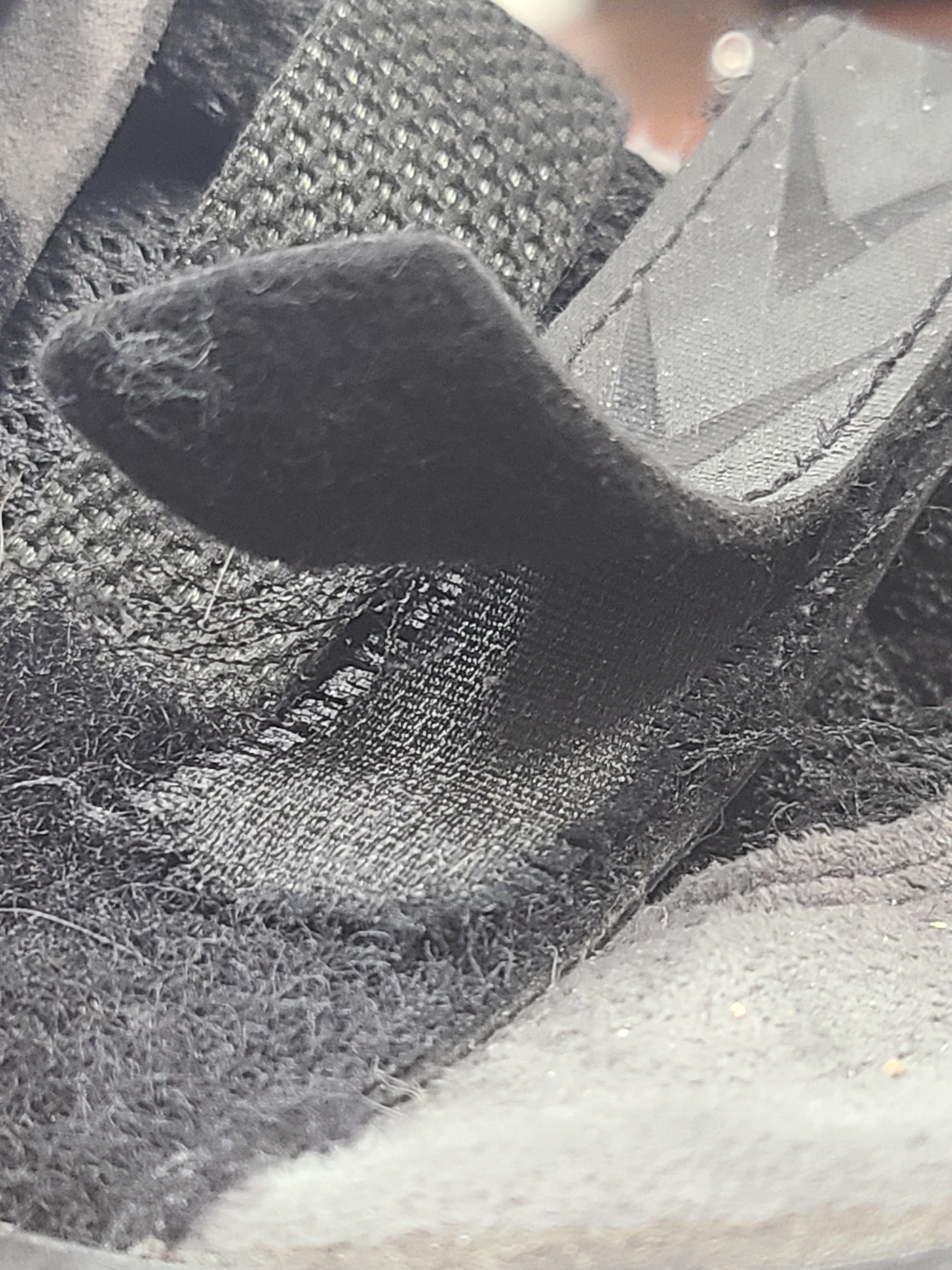 Velcro peeling from its leather strap on climbing shoe. More info in