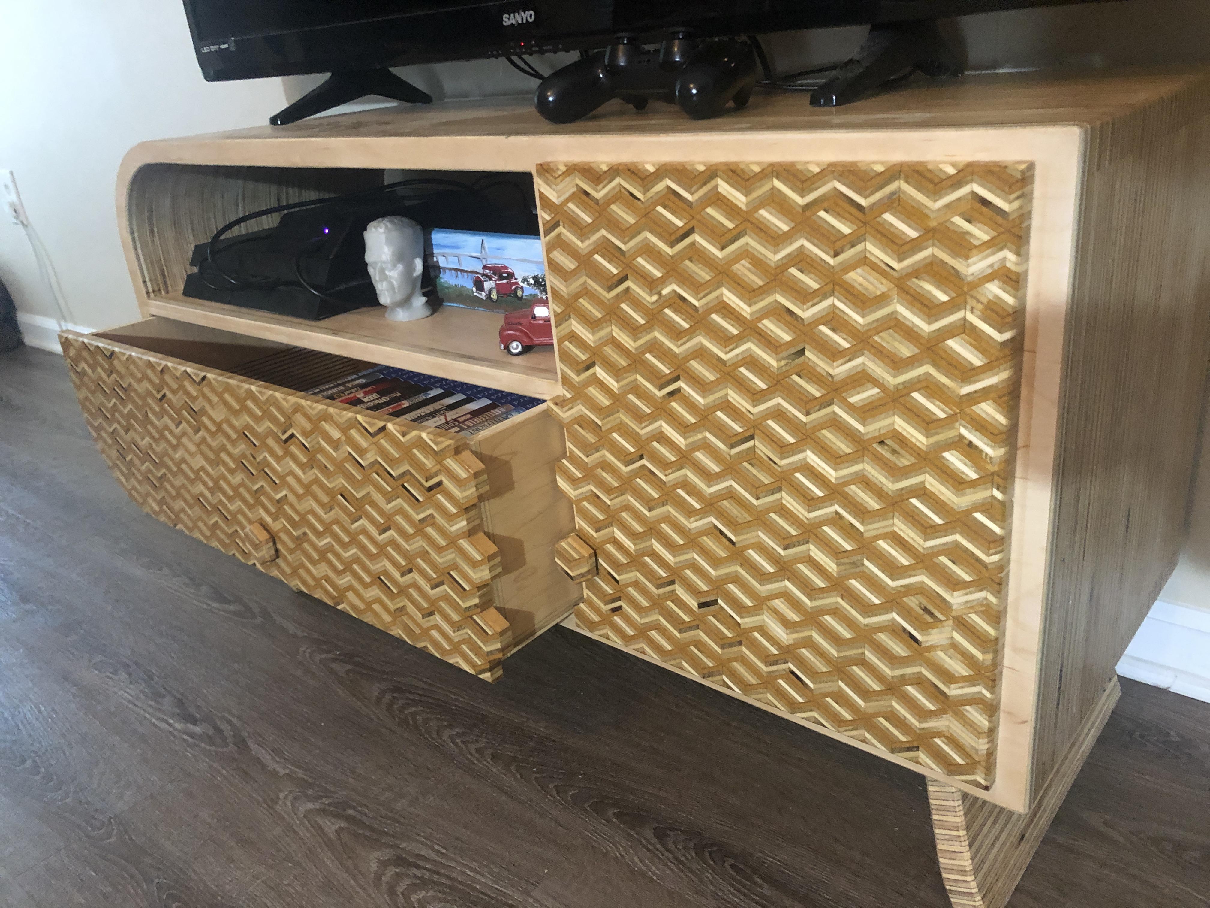 I made a layered, patterned, kerf bent plywood tv stand. I put a link