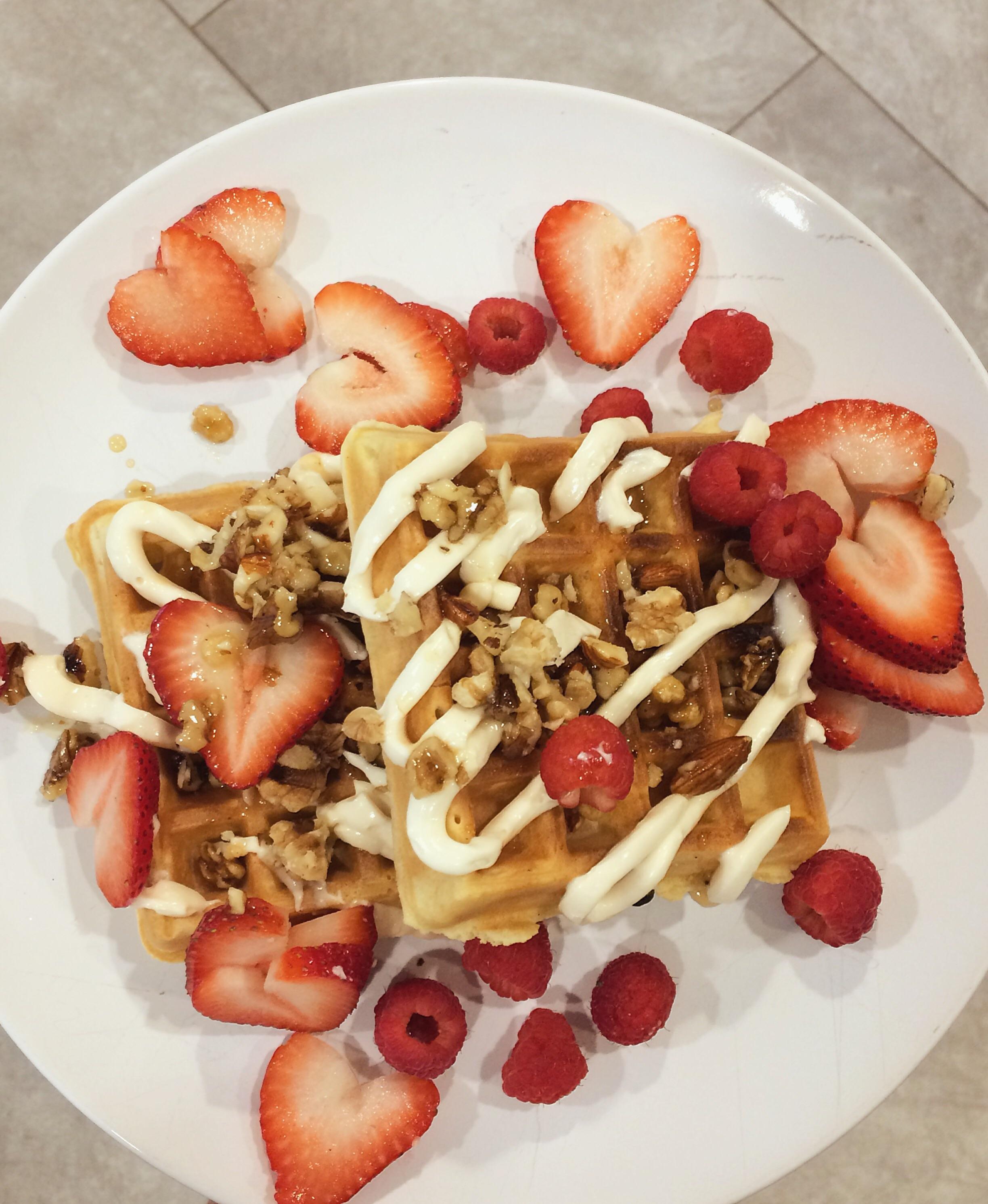 belgian waffles with a vanilla cream cheese drizzle, walnuts, almonds