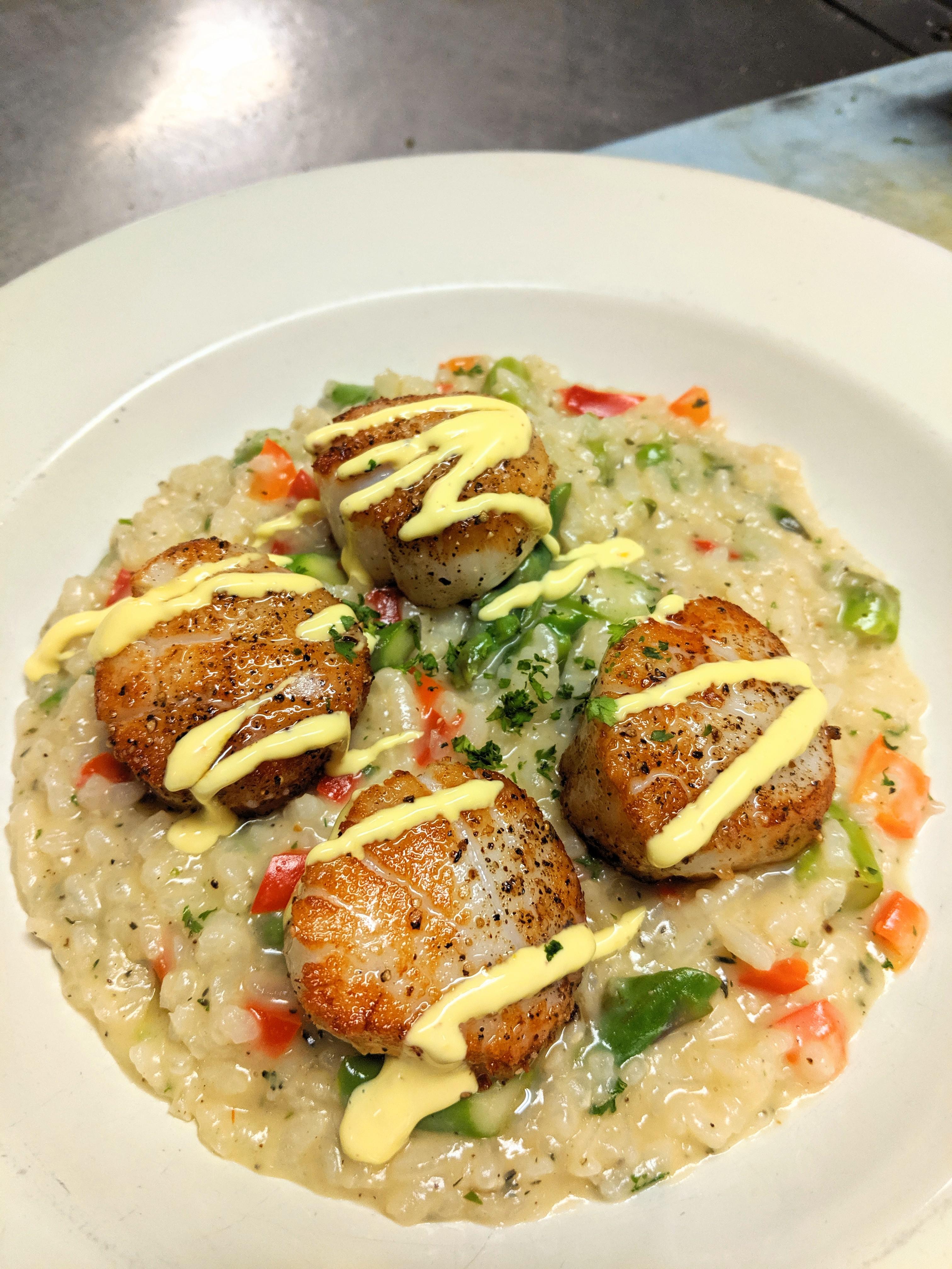 Seared Scallops served over a Red pepper Asparagus Lobster broth