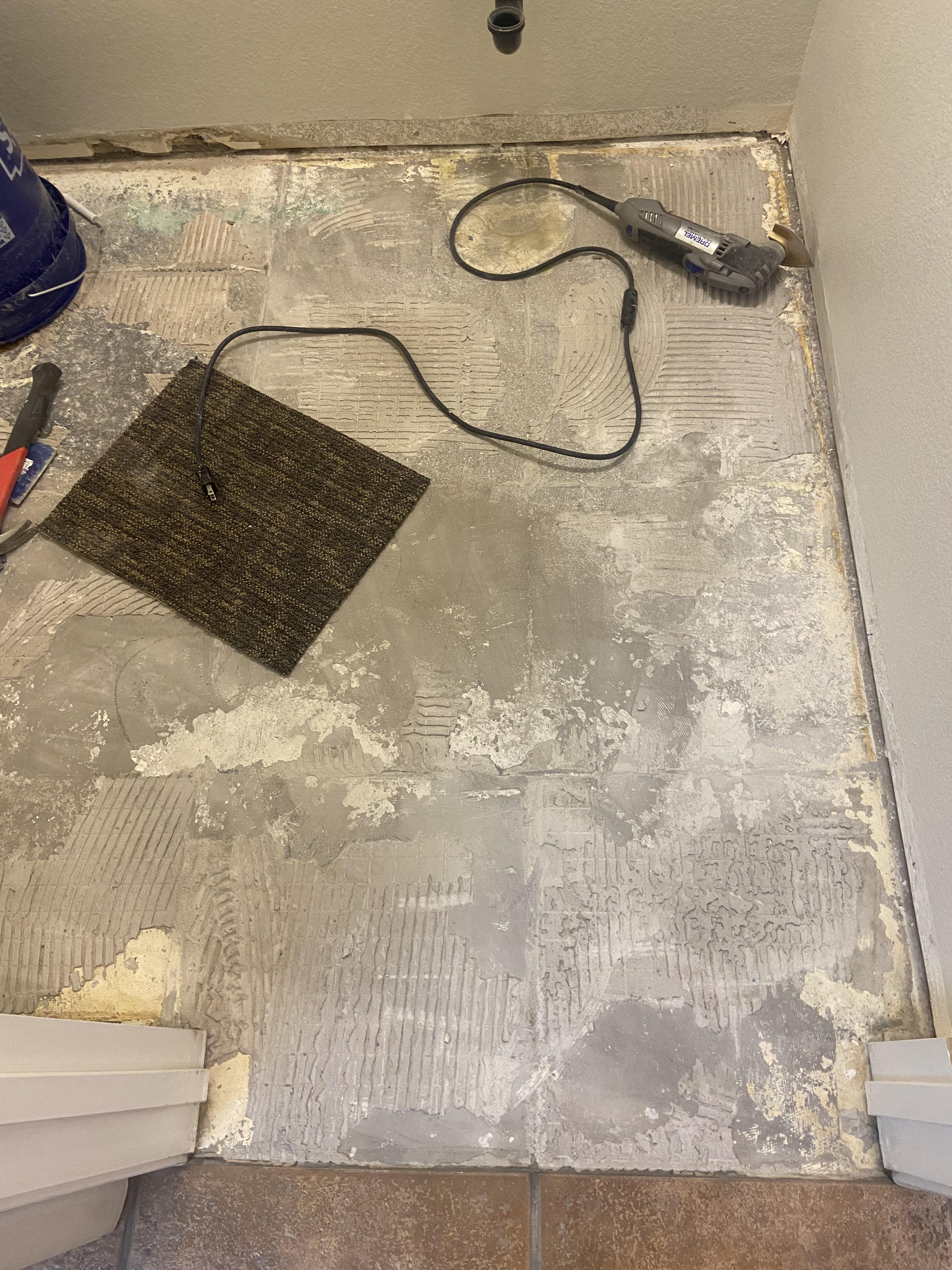 Best method for removing mortar bed off concrete grade from small