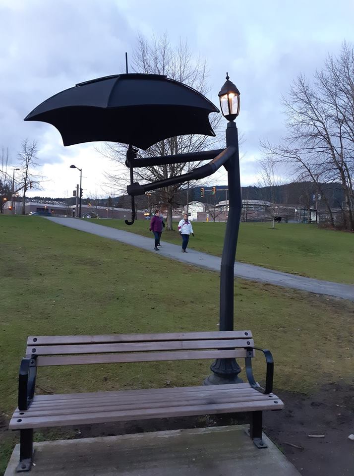 This cute lamp post holding an umbrella r/pics