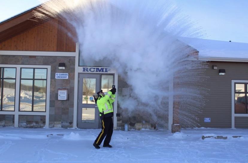 Fraser Lake BC, Canada, RCMP Sgt. showing how cold it is. 32 C r