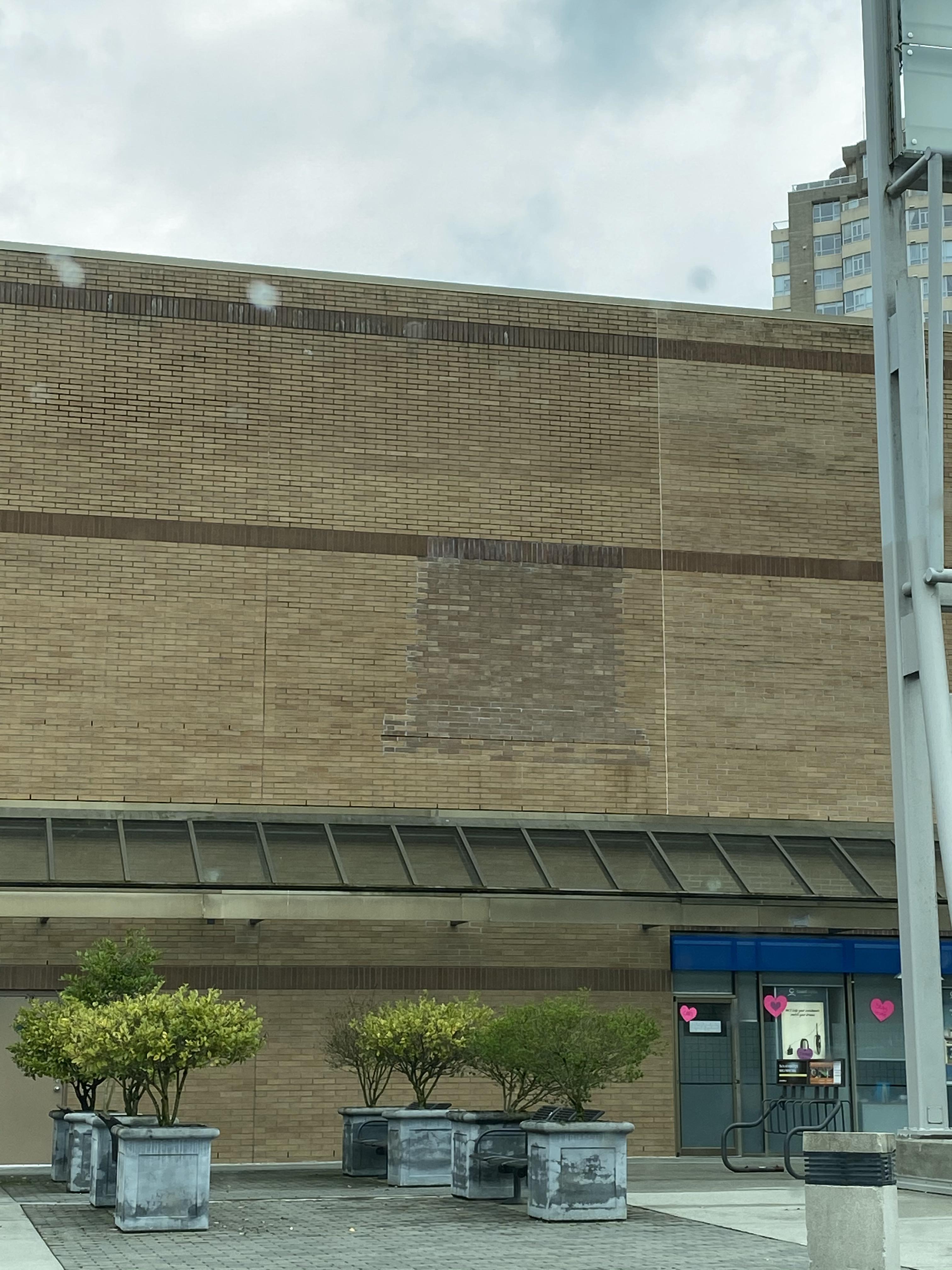 What’s the meaning behind the patched wall at The Bay in