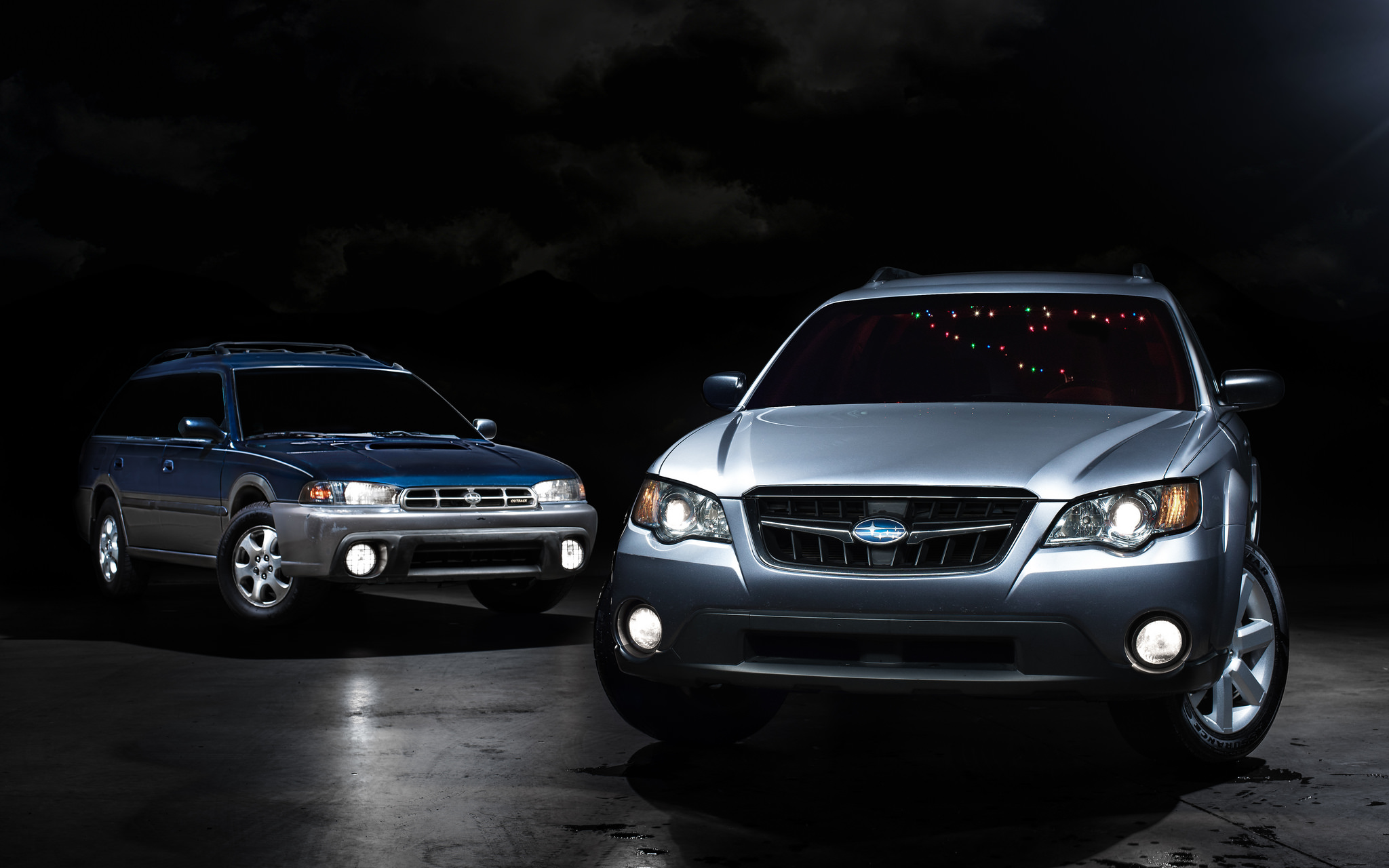 My '98 Legacy Outback and the new(er) '08 Outback. Both as stock as it