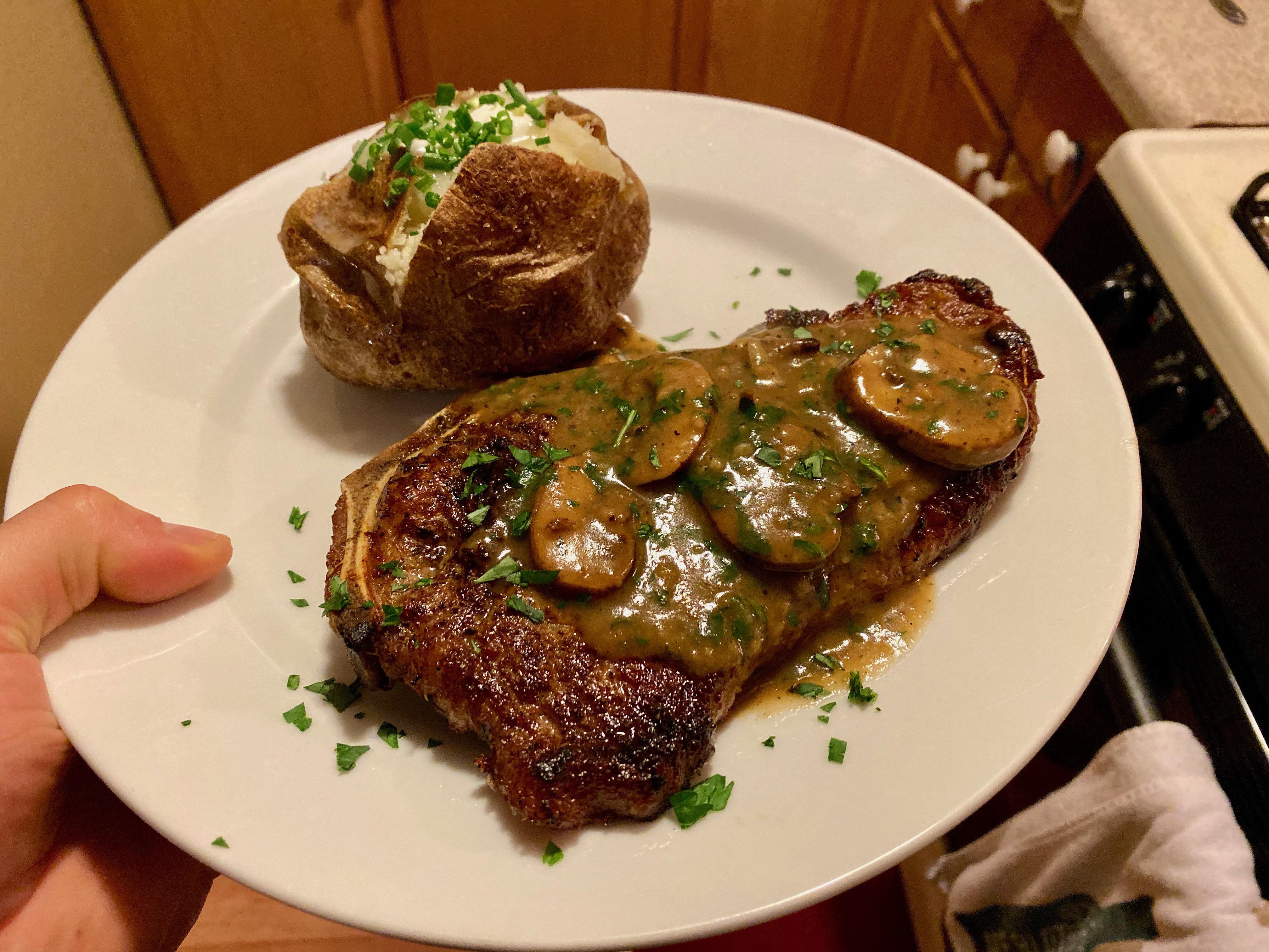 my dinner tonight! rib eye with quick mushroom sauce and side. r/steak