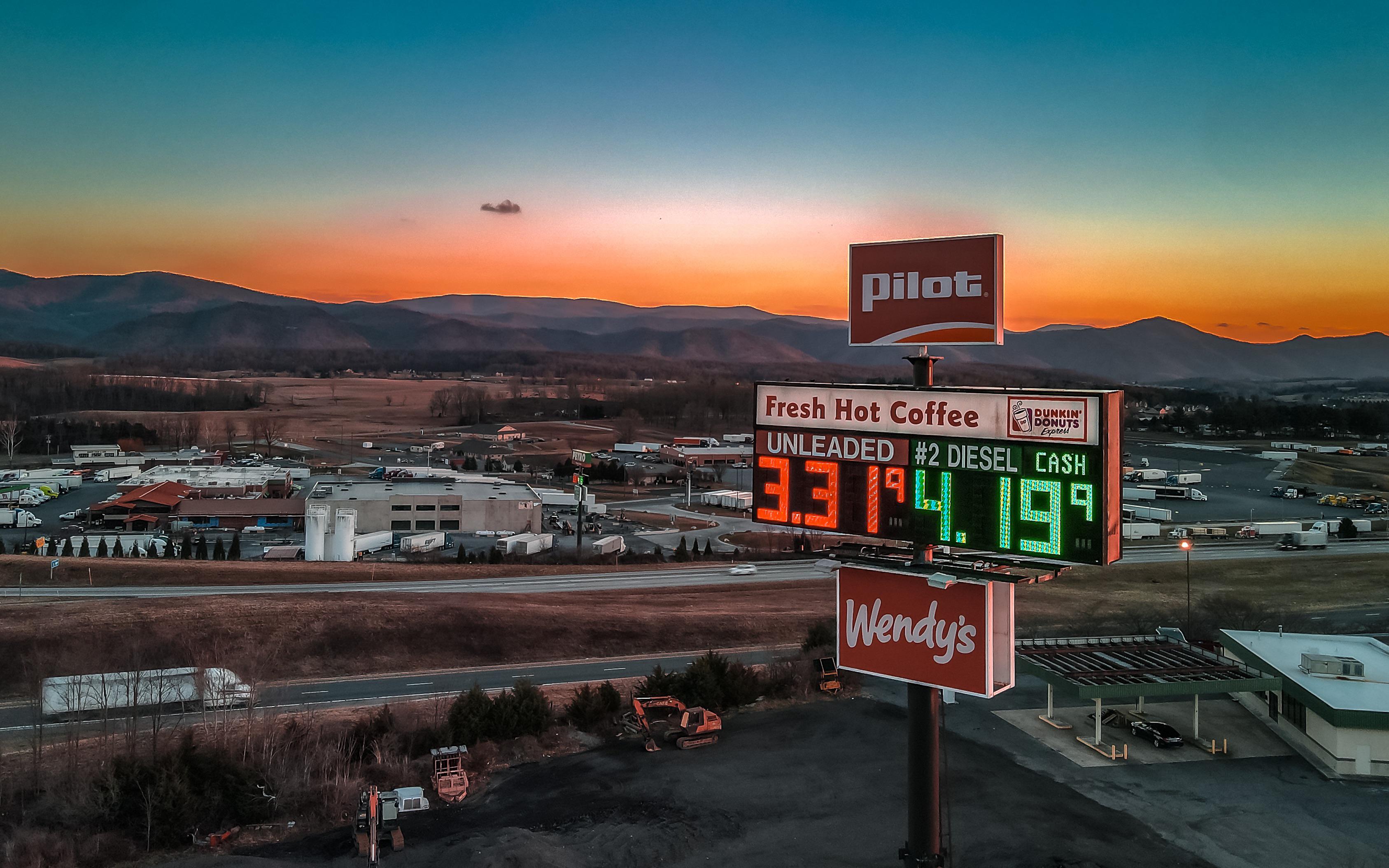 Sun setting on a Gas station in West Virginia r/drone_photography