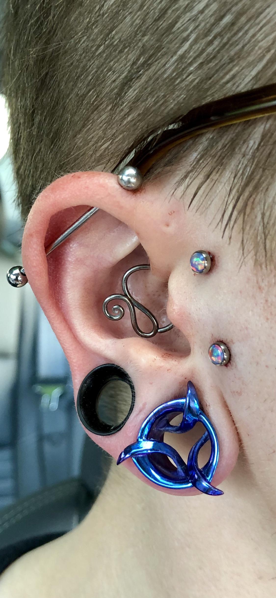 my sideburn surface piercing, done yesterday by Luis Garcia. r