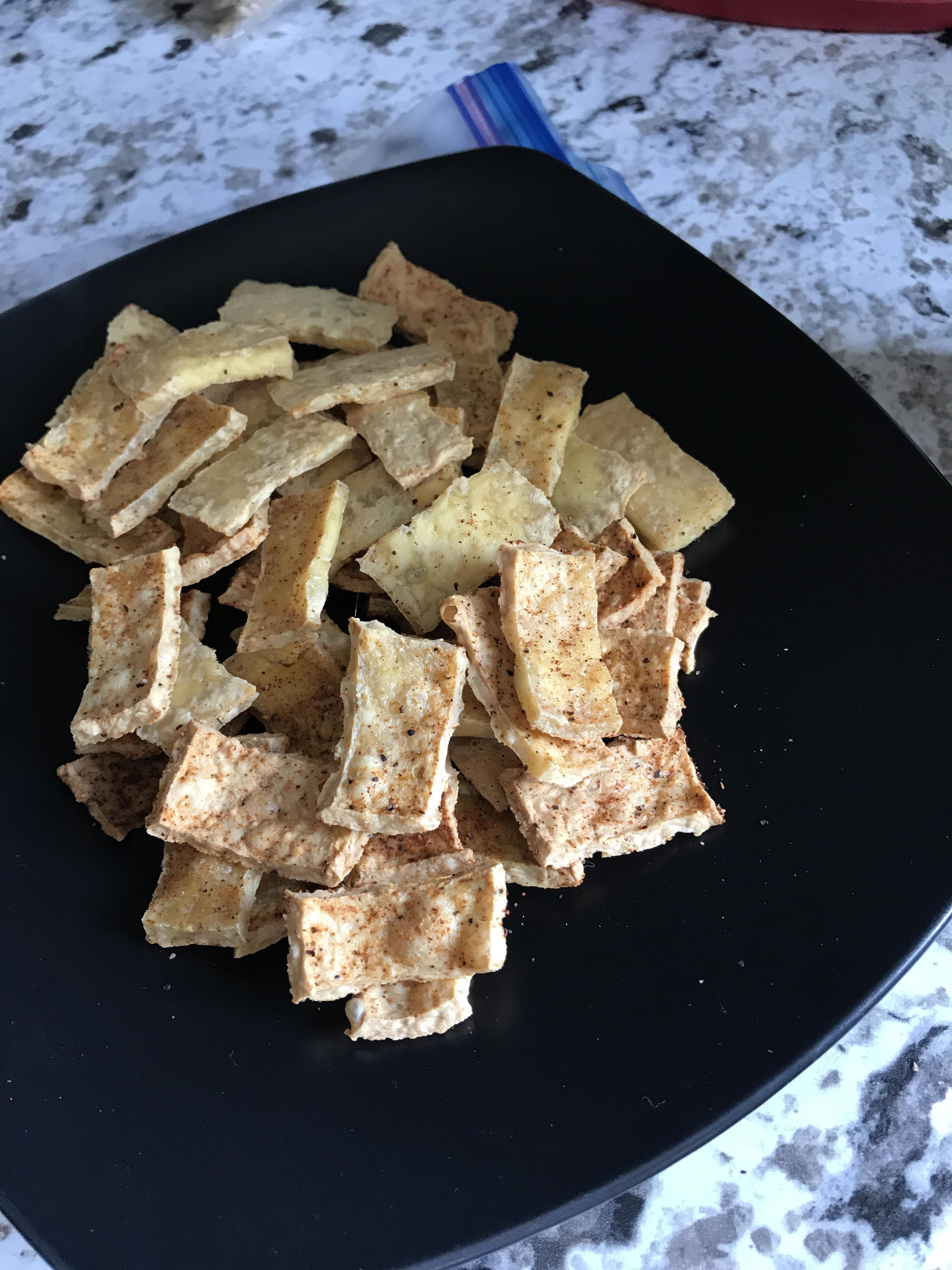Dried baked tofu chips. They taste like pork rinds. 👌 r/vegan