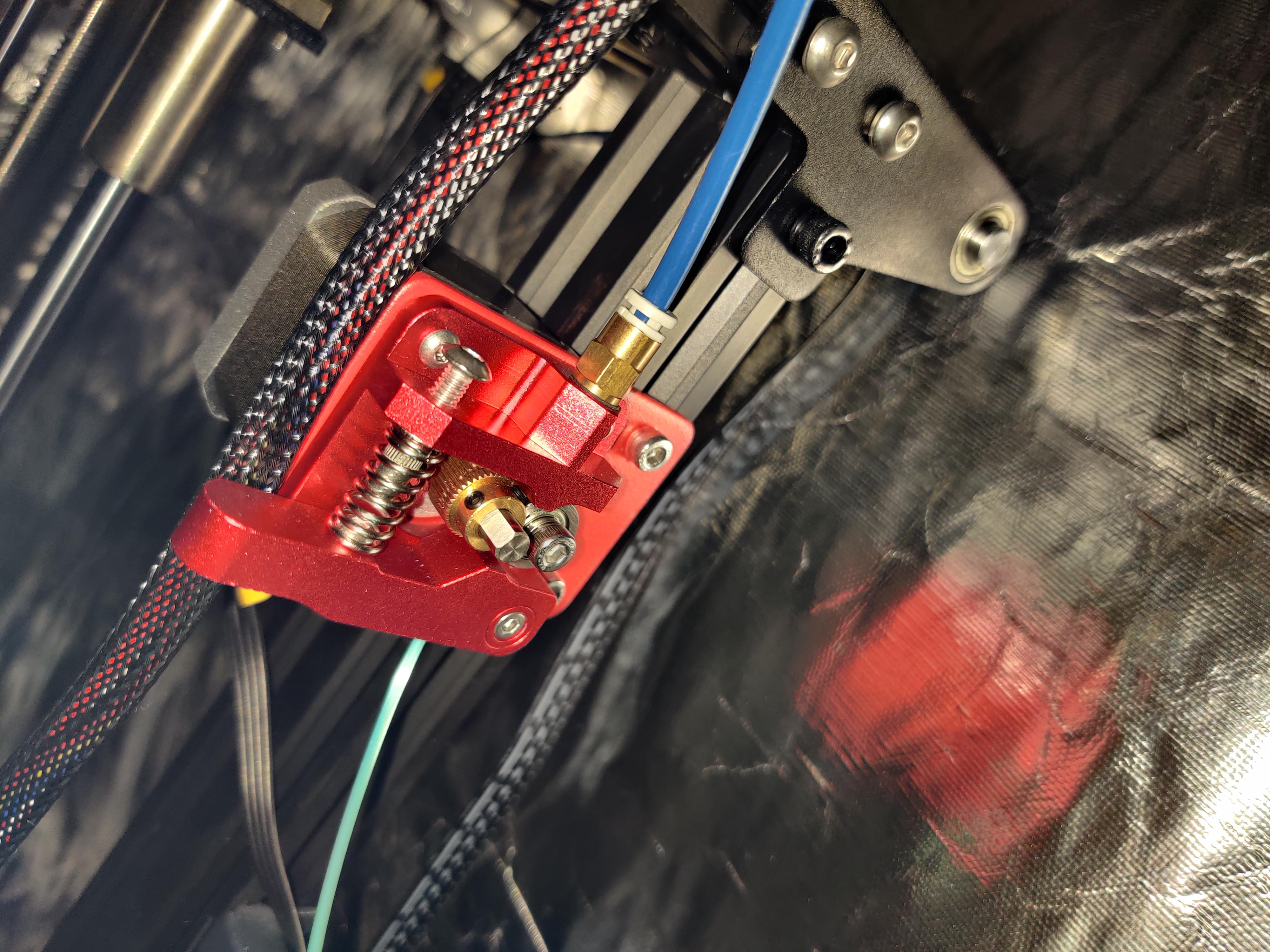 Extruder feeder (not sure of the name?) too tight. I've loosened it as