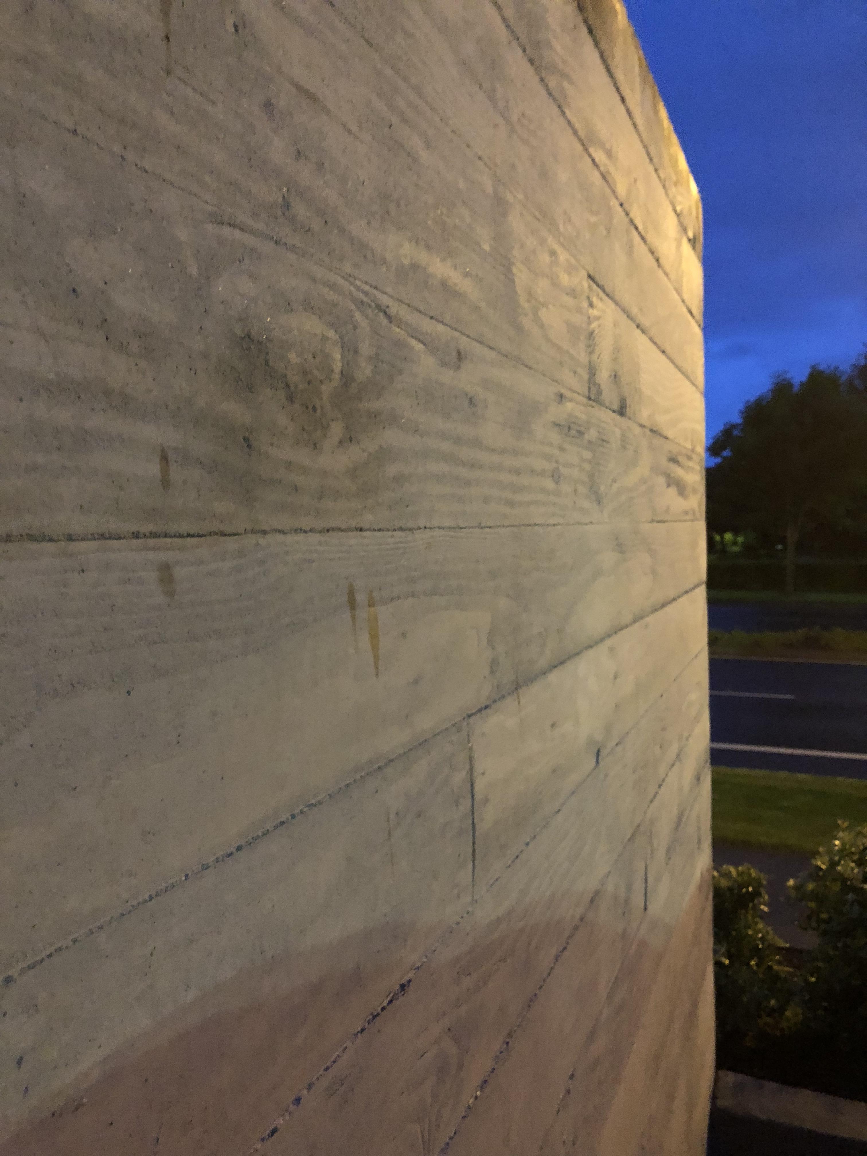 This concrete wall has been pressed to look like wood panels. r