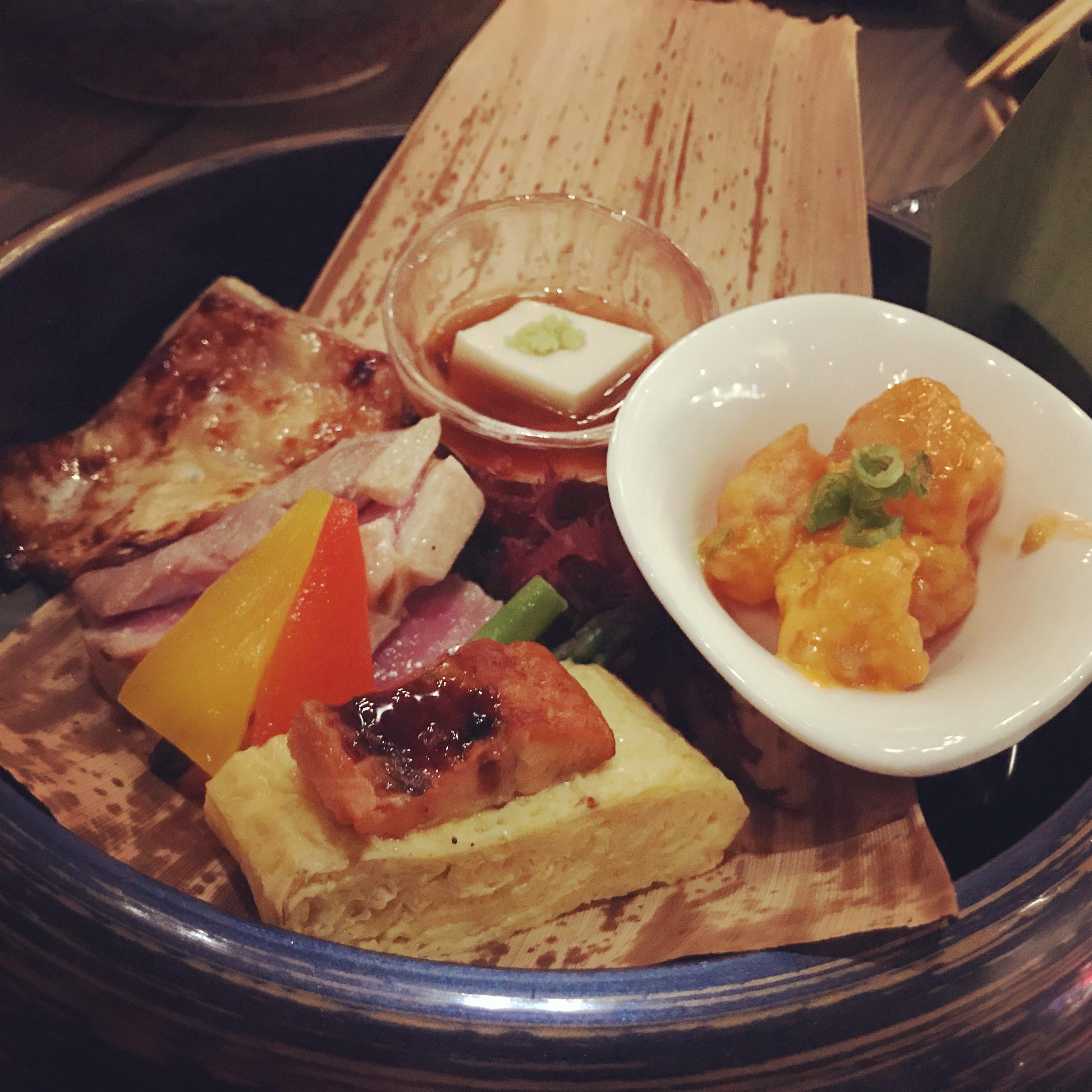 Omakase at Wokuni (NYC). This course has (clockwise) sesame tofu