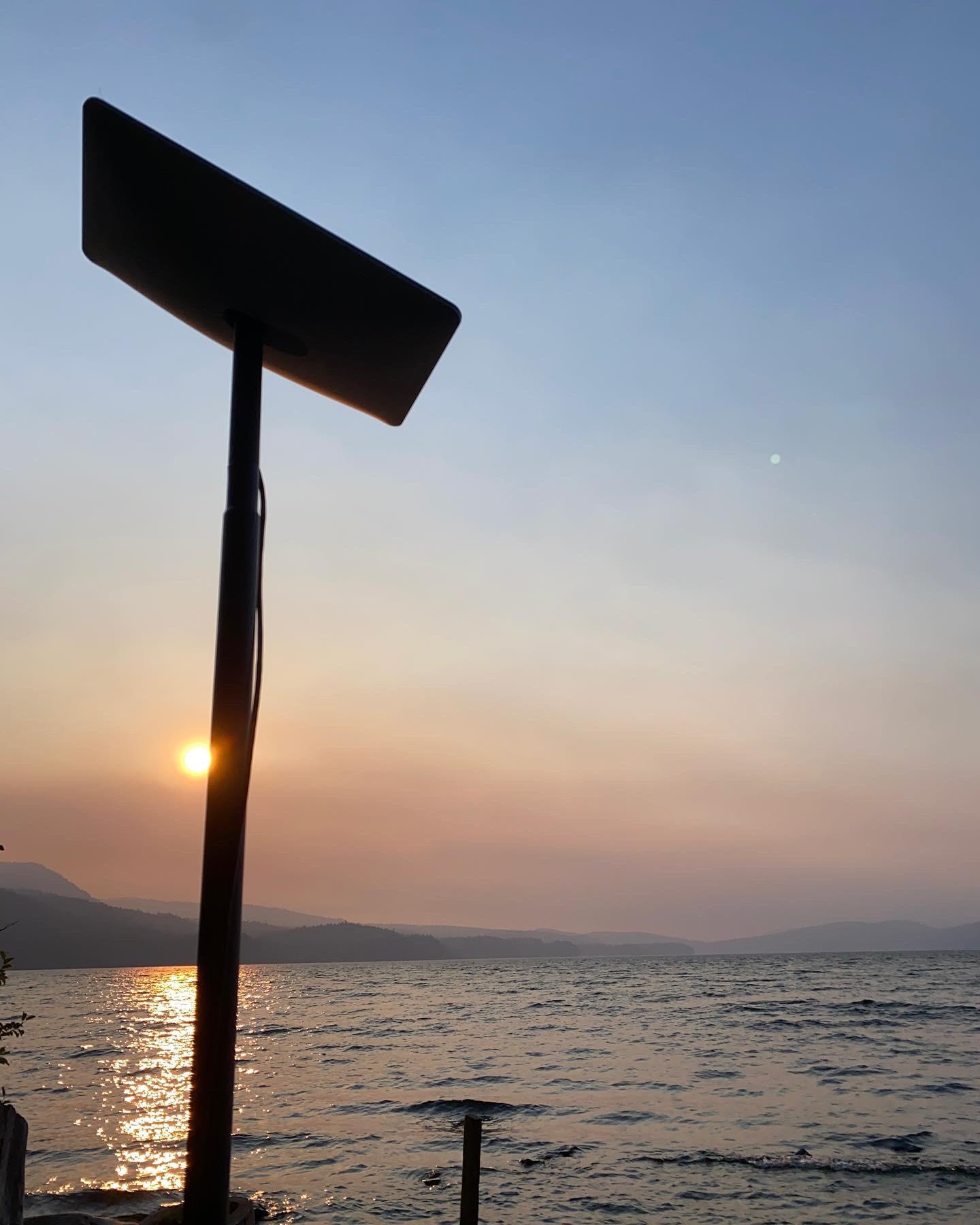 Patio umbrella stand holding Starlink pole mount. Moveable for best