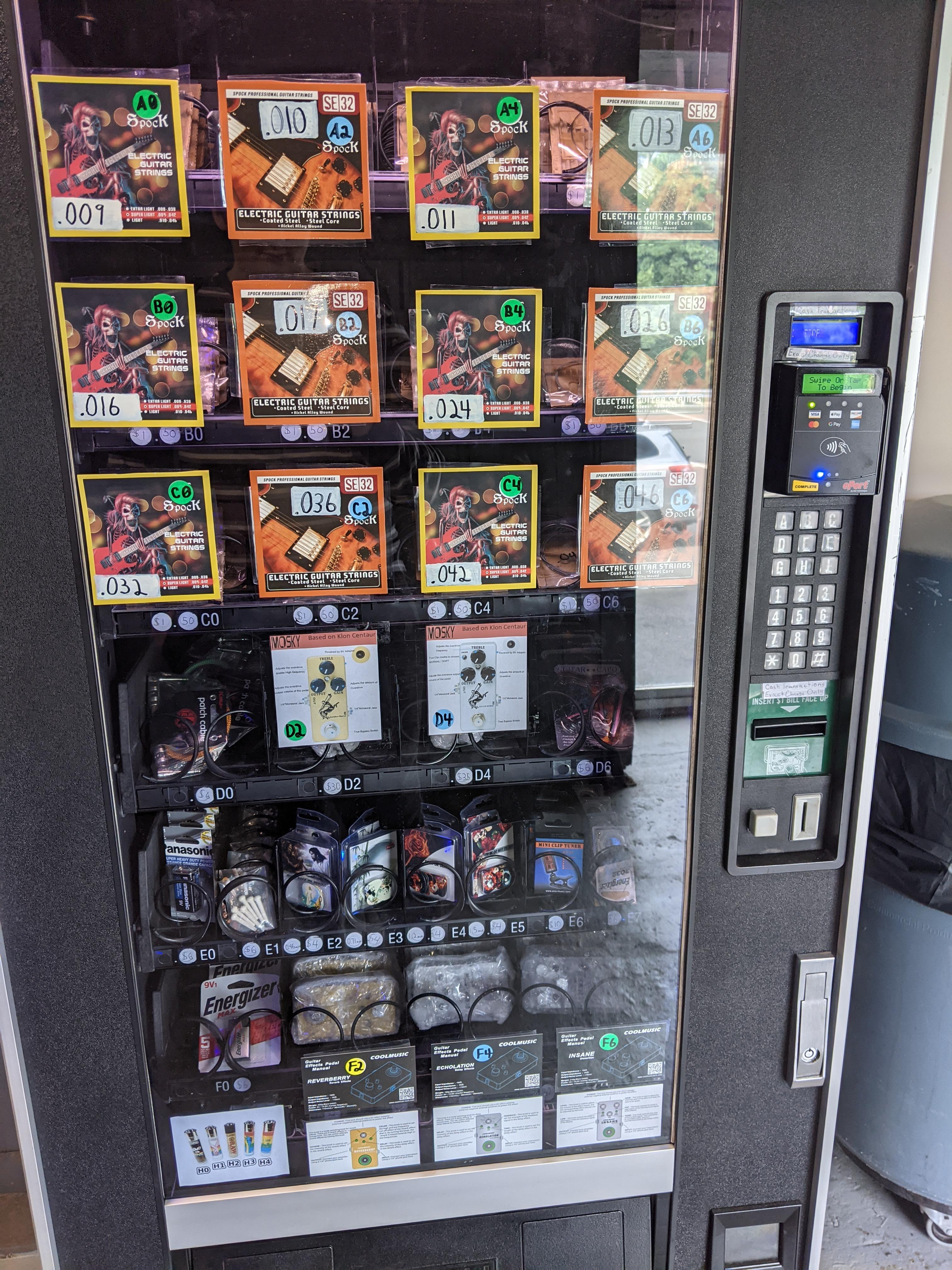 Vending machine at music studio is filled with guitar gear (strings