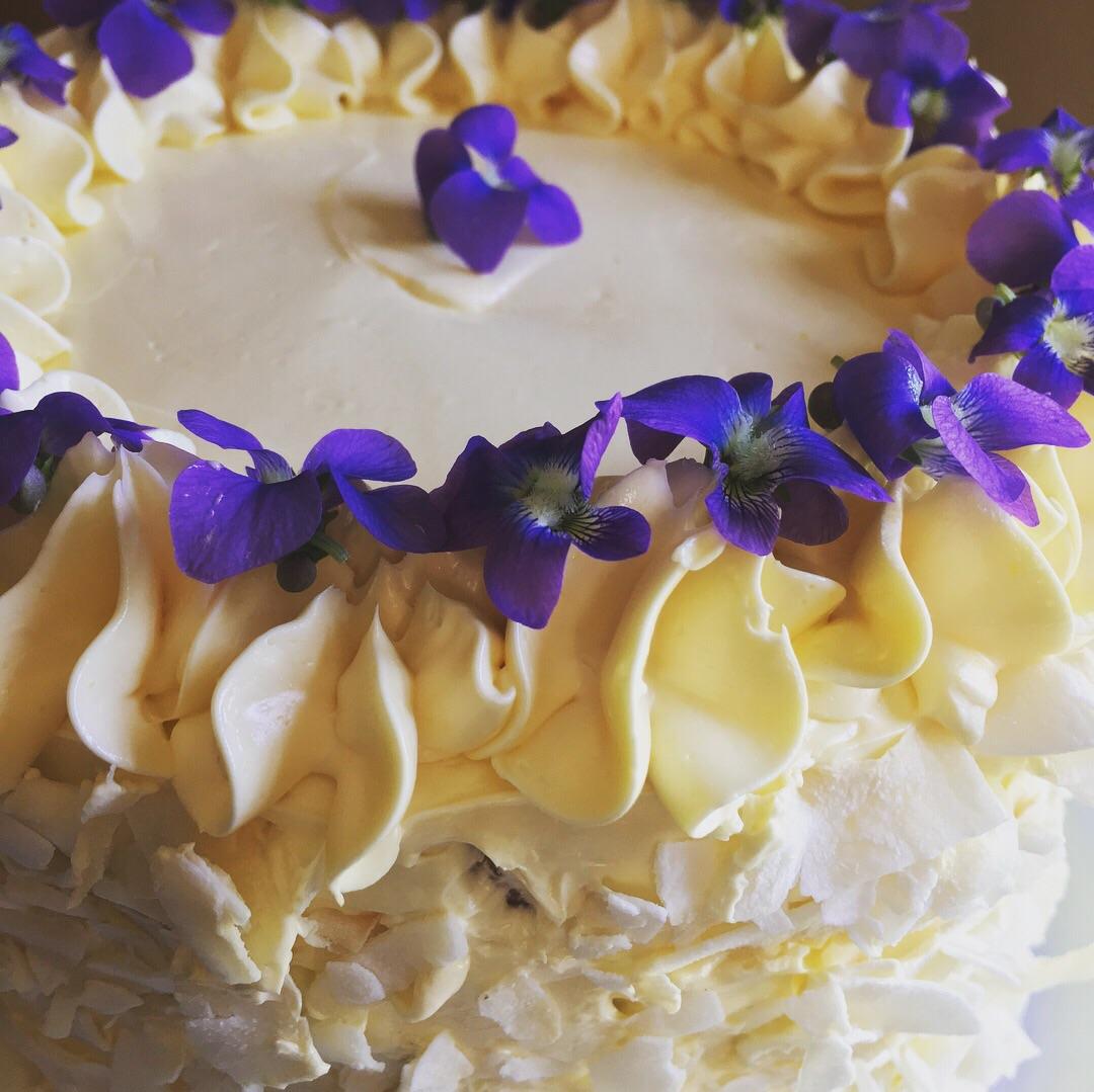 Coconut cake with violets from my garden. r/Baking